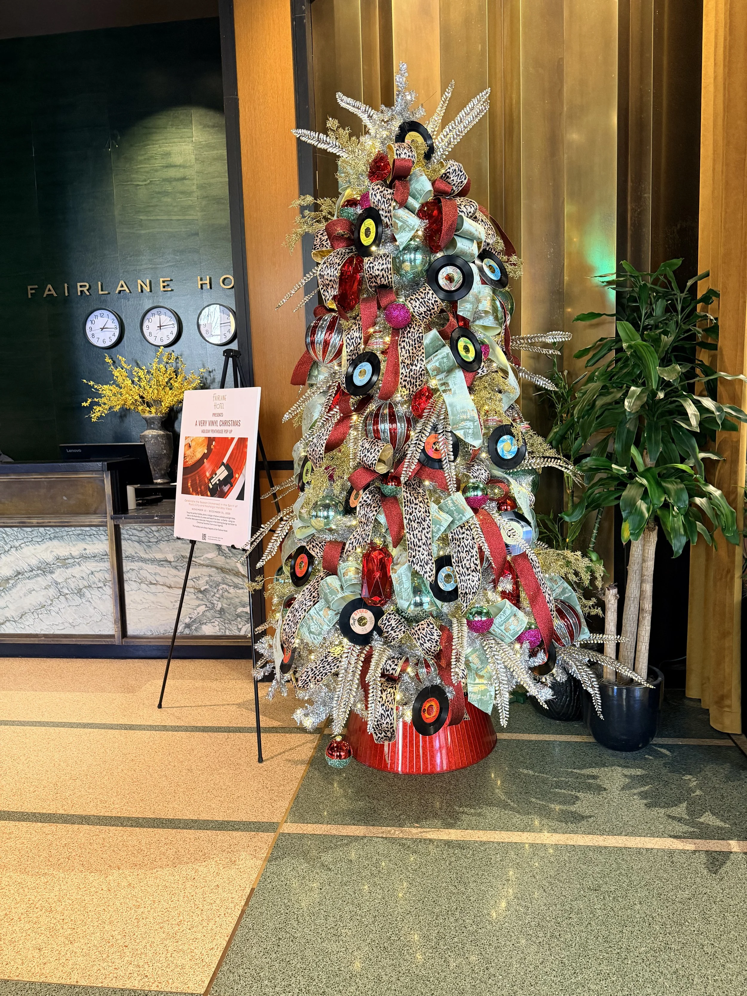 Custom themed Christmas tree installation for a Nashville hotel lobby by Whitney Elaine Interiors