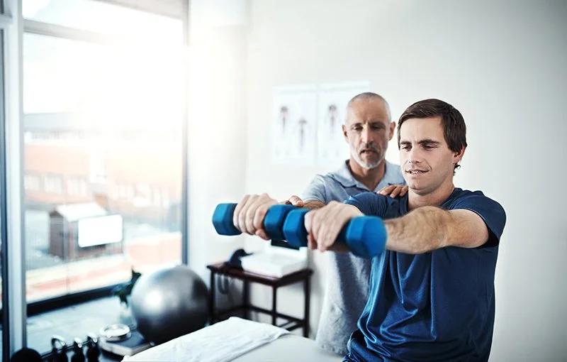 Patient performing strength training exercises as part of post surgery physiotherapy rehabilitation