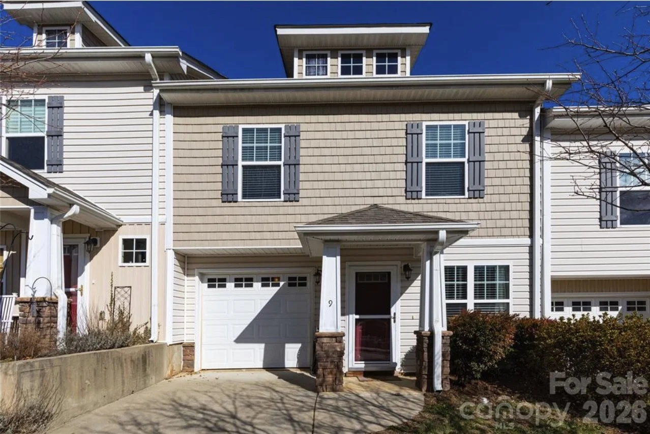 Townhome with garage and cedar shake siding located in weaverville nc