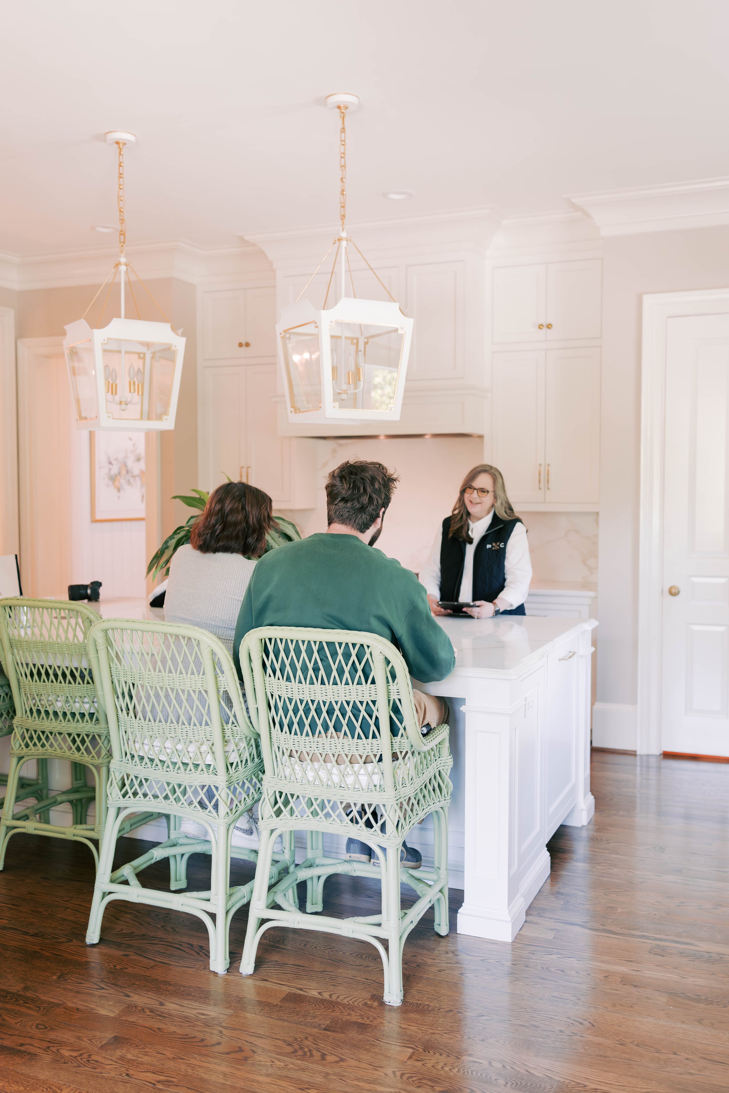 Pickett Concierge meeting with homeowners at their kitchen island.