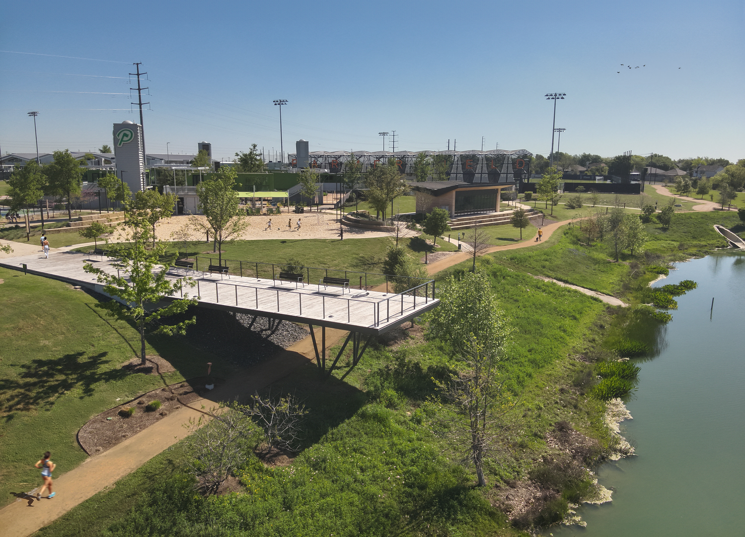 Parmer Pond decking & cladding by Forsite Studio — rendering of park with walking paths, pond, viewing platform, and sports field — Austin, TX
