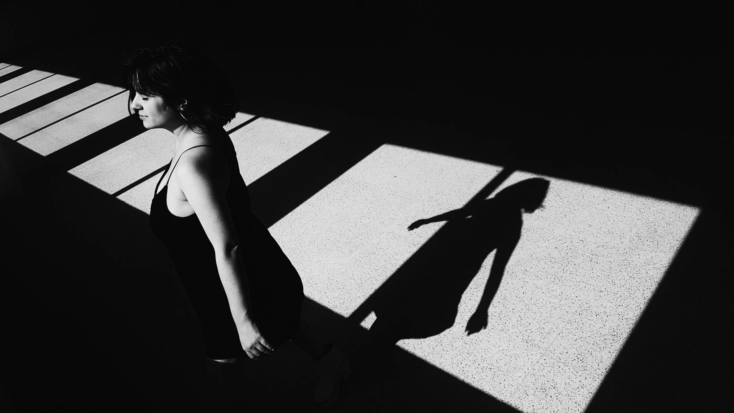 individual ready for changing dancing with her shadow of the identity she wants to leave behind ready for online therapy to empower change