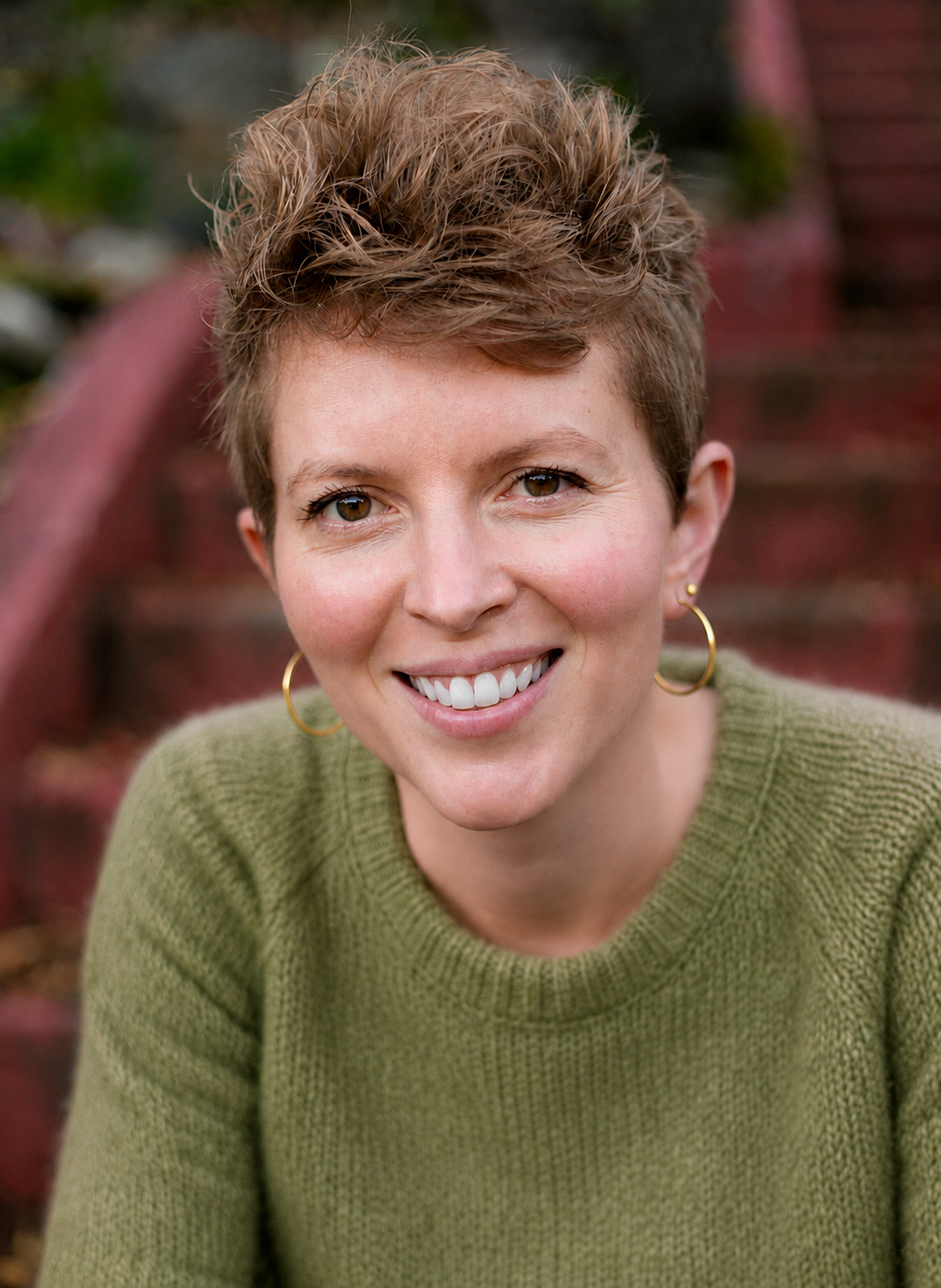 therapy in oakland woman smiling in green sweater