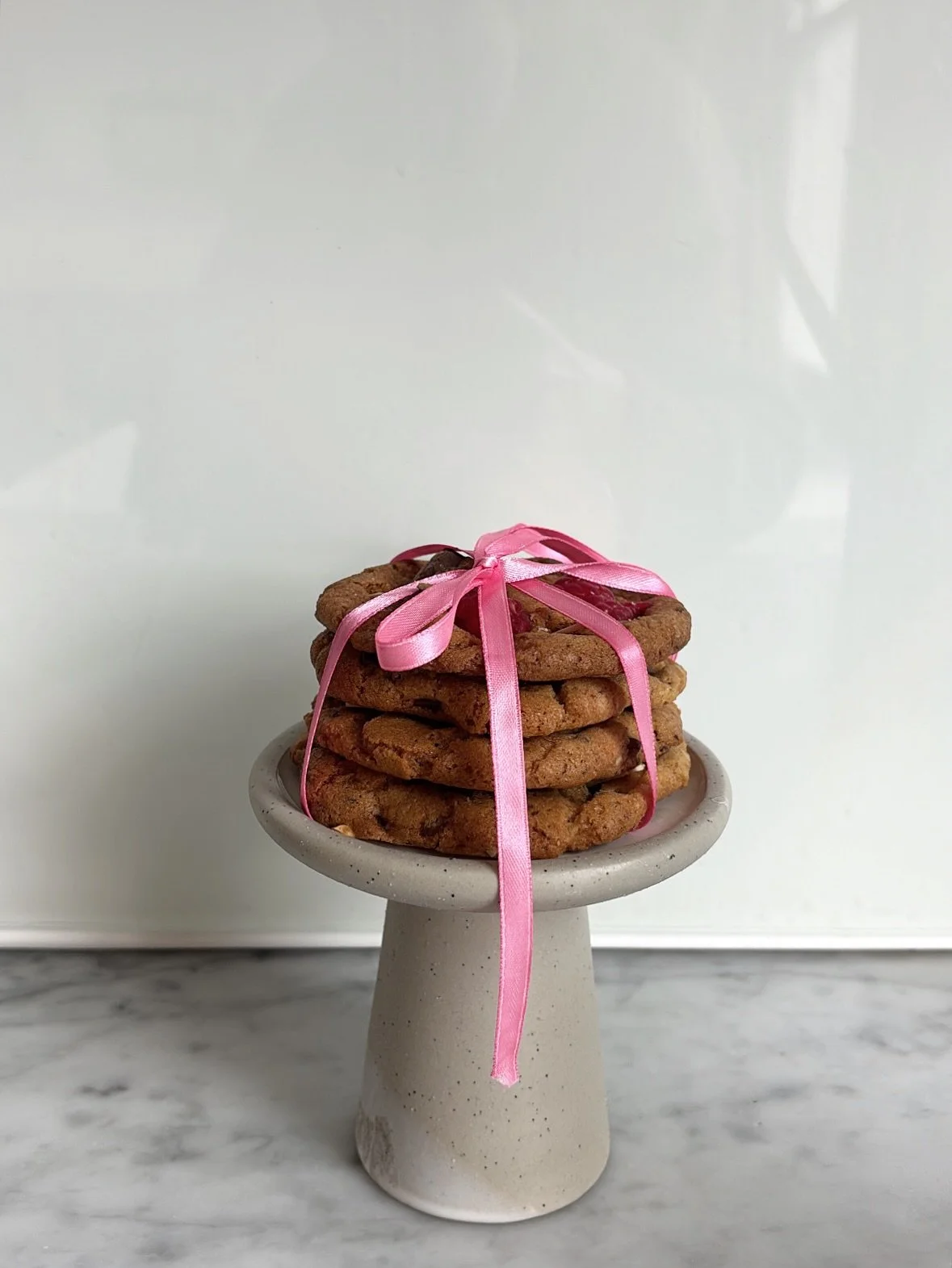 Freshly baked cookies tied in a bow for friends. Is this alarmingly tradwife behaviour considering that I also just tried to paint using the juice of freshly squeezed oranges? 
If I start sleeping with men please alert the authorities, something terr