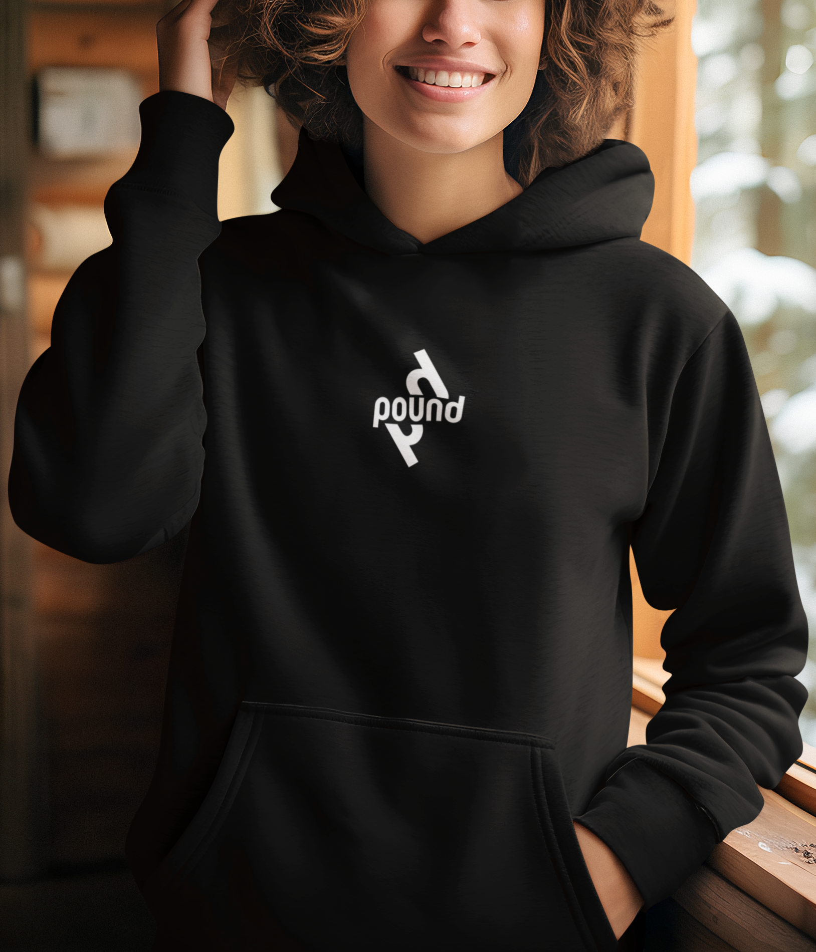winterwear-mockup-of-a-smiling-woman-generated-by-ai-wearing-a-hoodie-in-a-cabin-m36110.png