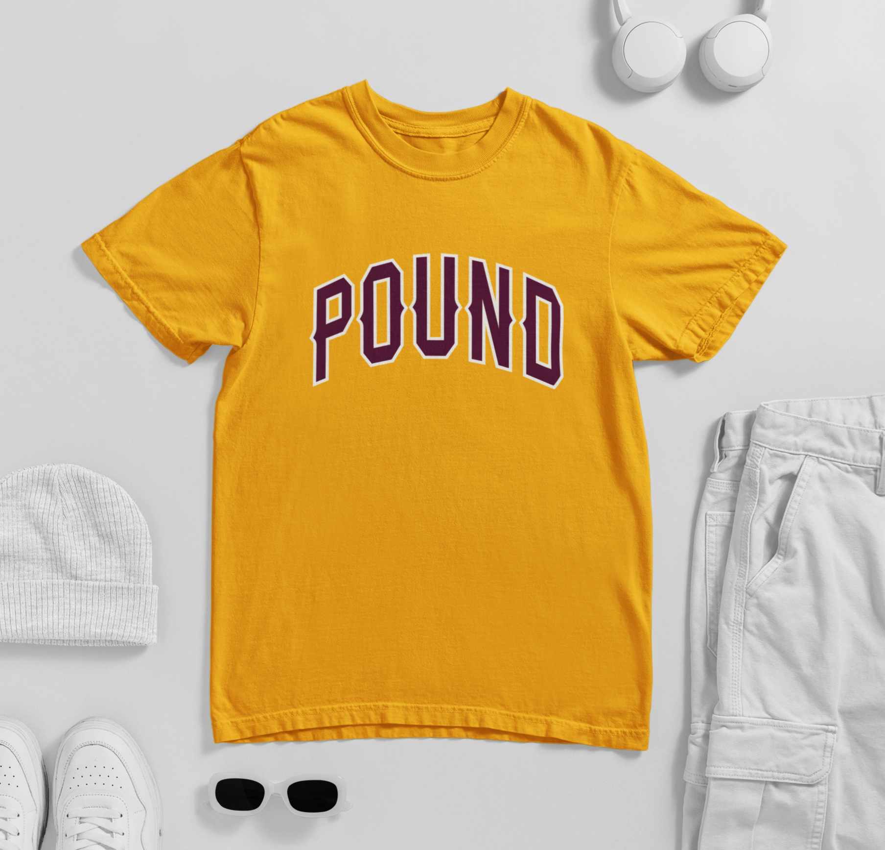 comfort-colors-mockup-featuring-a-round-neck-tee-lying-on-a-surface-with-garments-m57251.png
