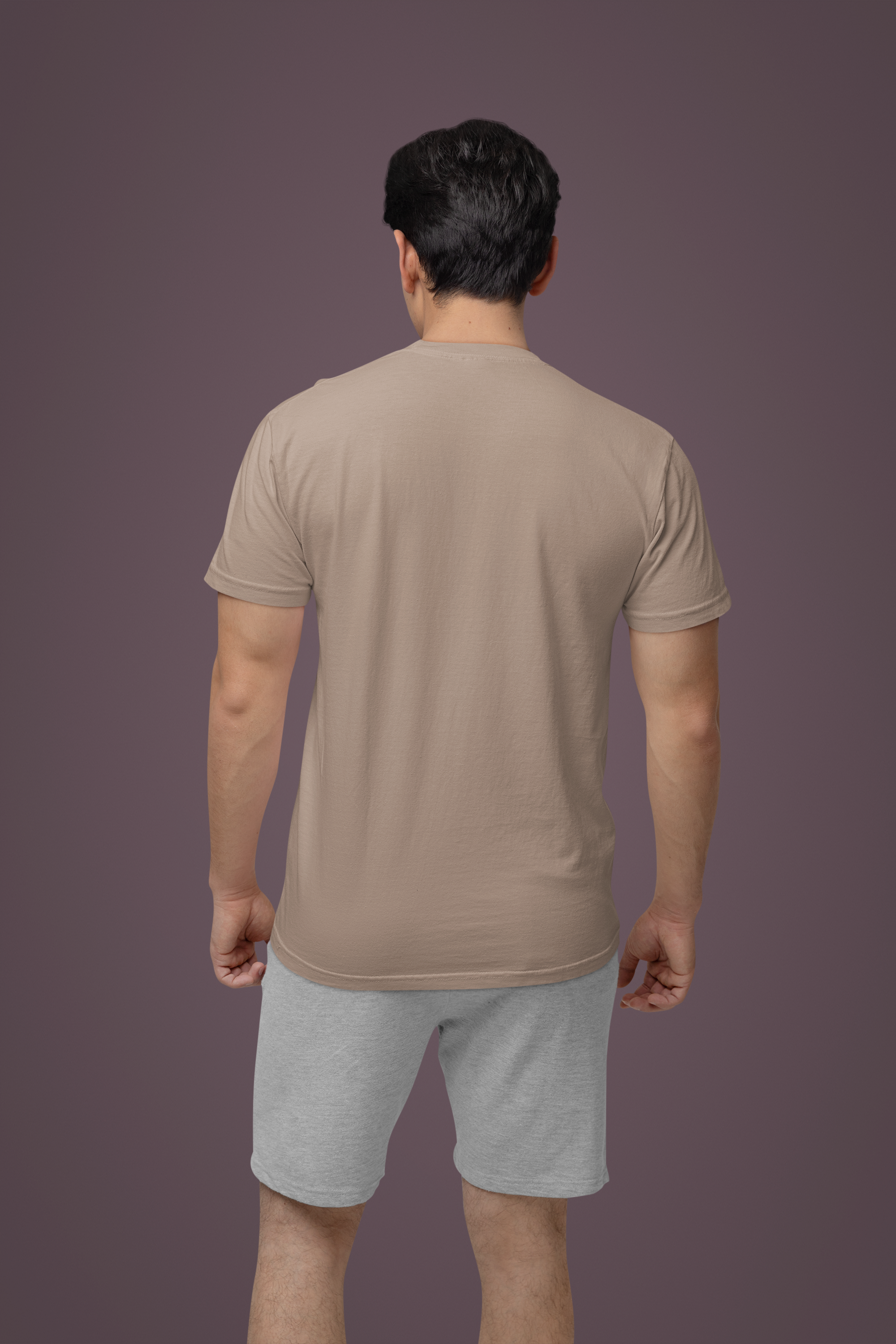 back-view-comfort-colors-tee-mockup-of-a-man-standing-against-a-colorful-wall-m53024.png