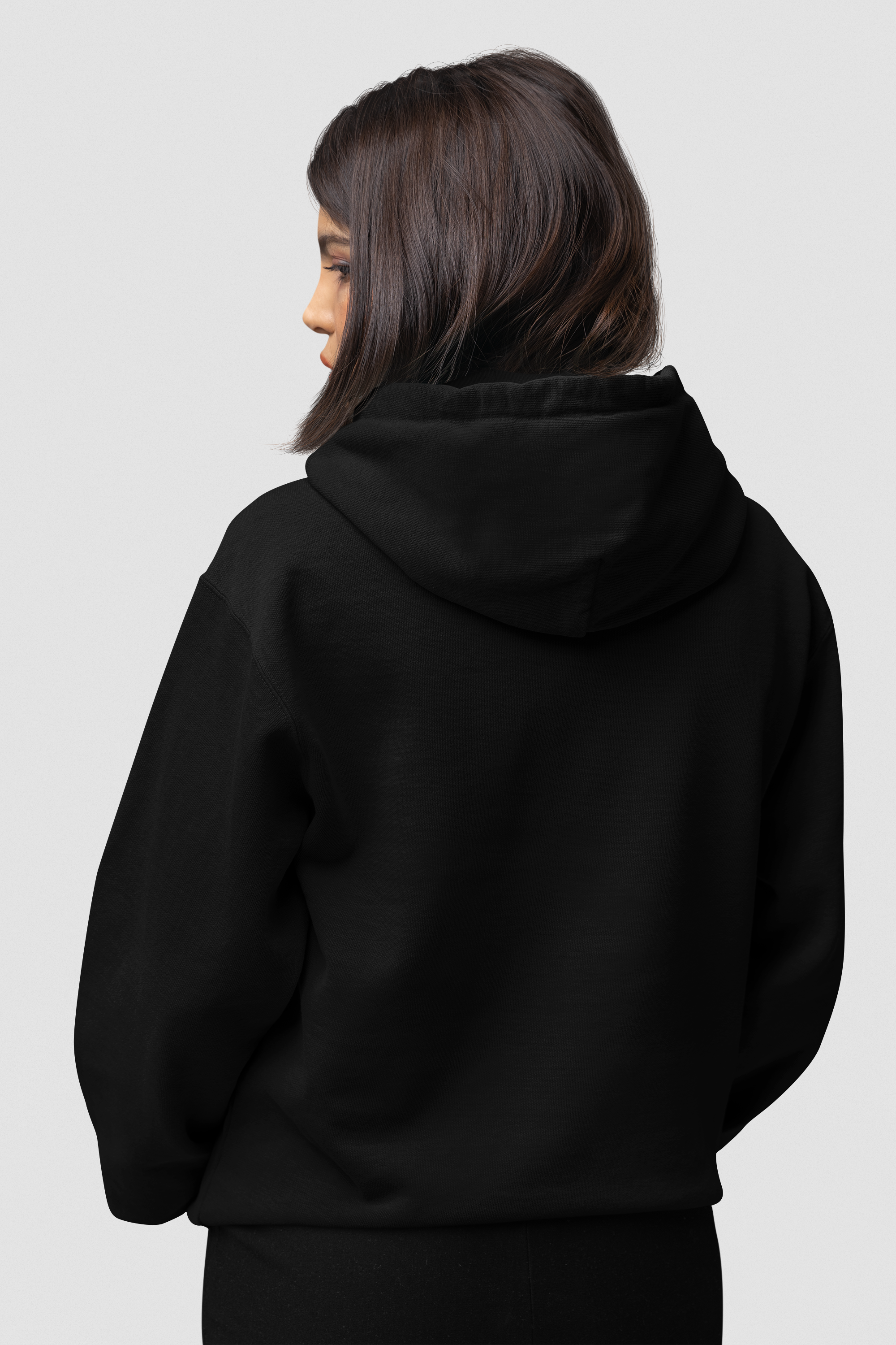 back-view-mockup-of-a-woman-wearing-a-comfort-colors-hoodie-with-customizable-sleeves-in-a-studio-m53151.png