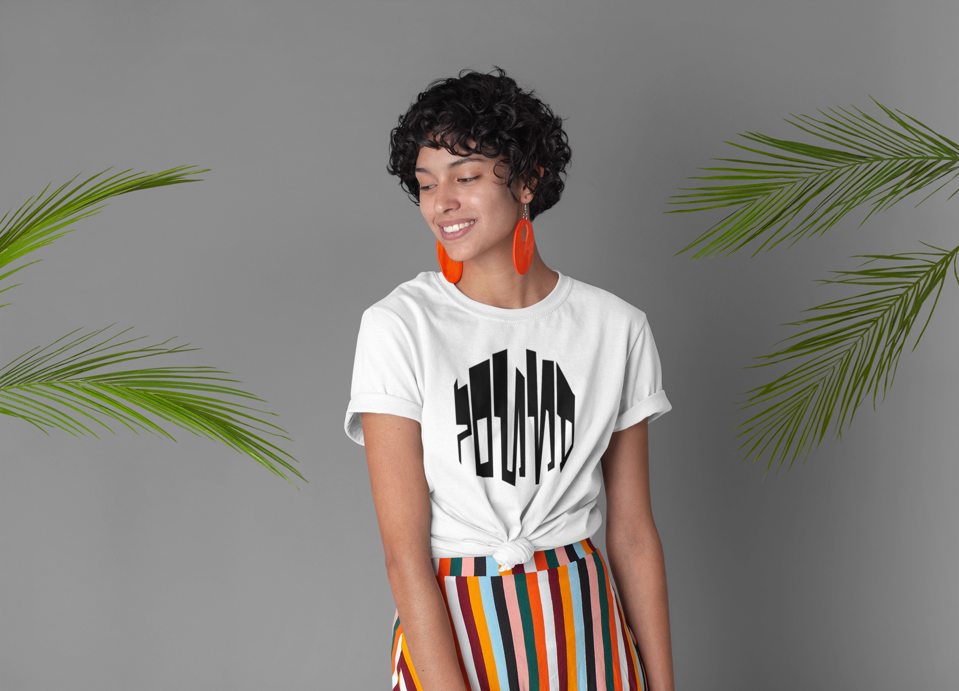 knotted-tee-mockup-featuring-a-woman-surrounded-by-palm-leaves-27290.png