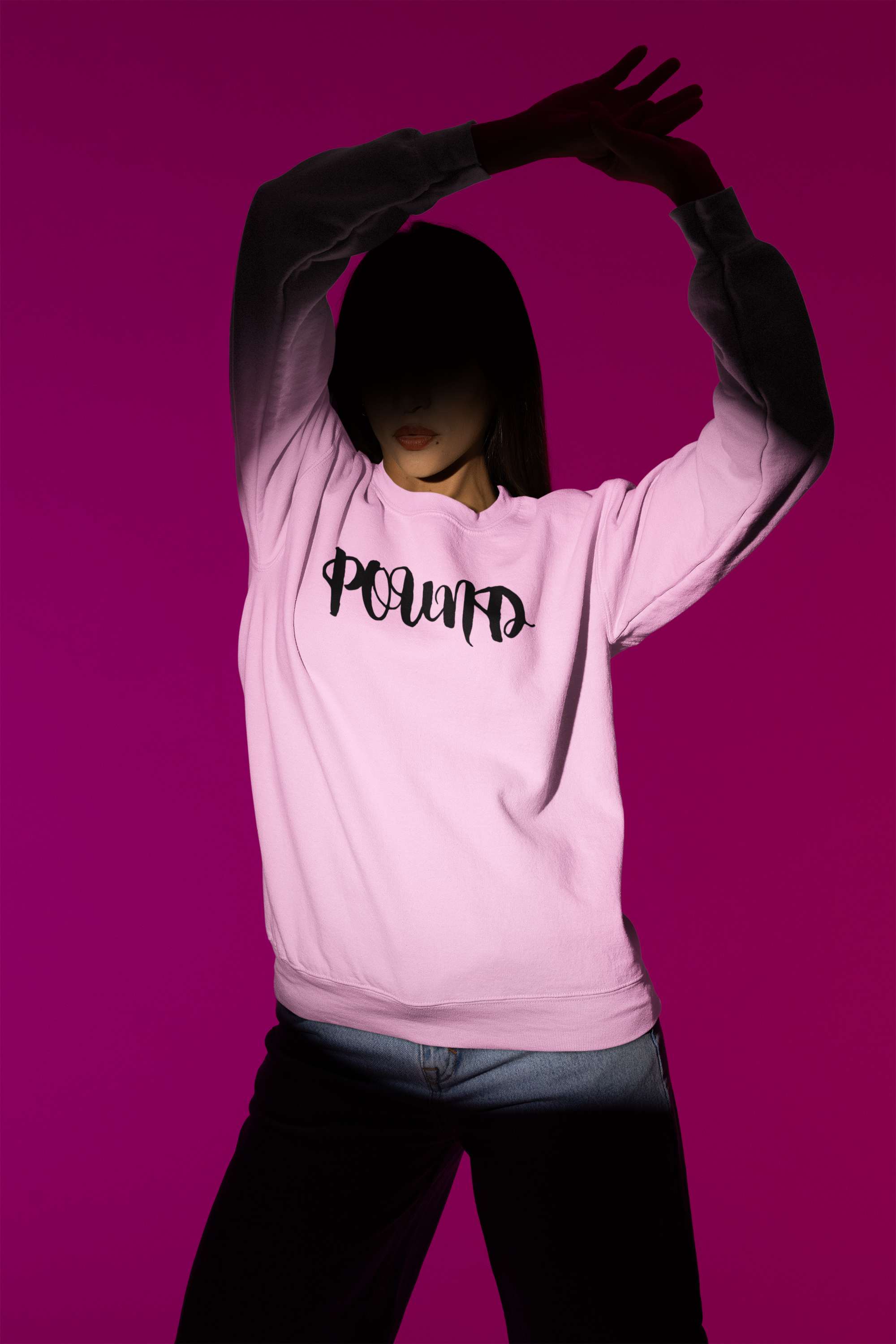 gildan-crewneck-sweatshirt-mockup-of-a-woman-with-a-serious-look-standing-under-a-spotlight-m50006.png