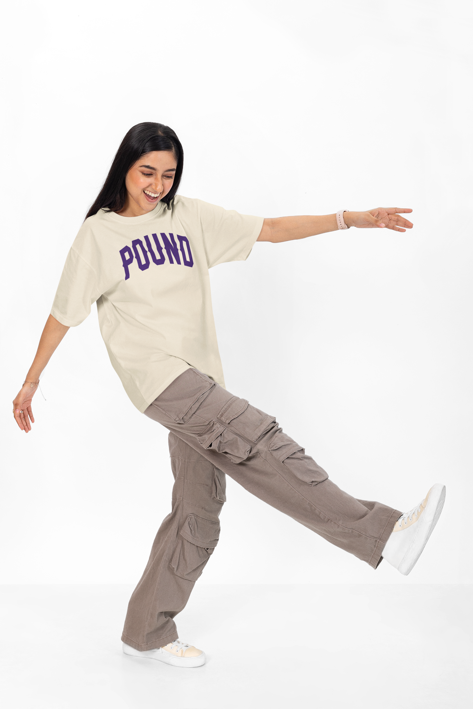 A woman wearing an oversized heavyweight cotton tee. Made by Pound Navy Blue high infused print is crisp and fashion on a high-end level, Los Angeles Designed and assembled.