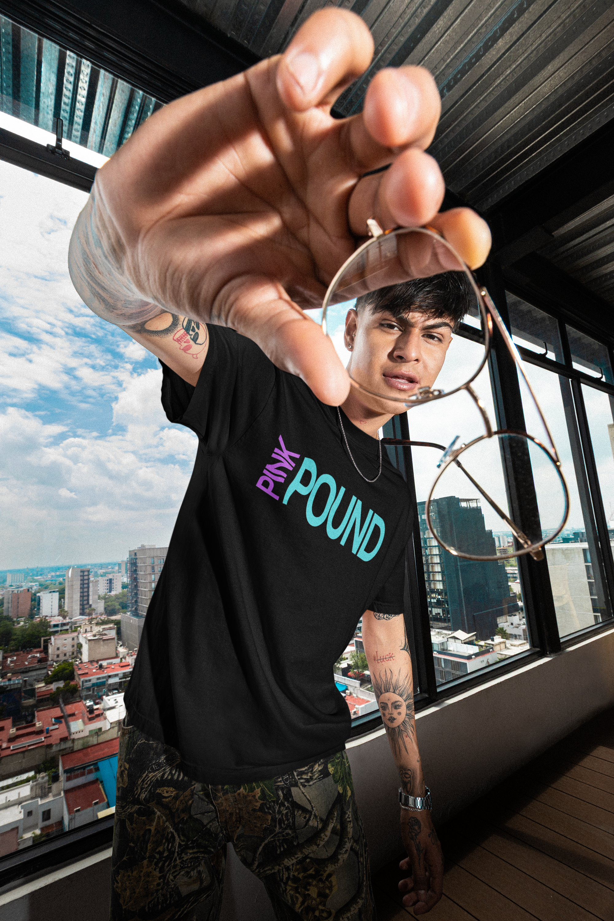 young male wear a Pound Brands Apparel Google Trending Fashion Chic Streetwear Clothing, Classic Black T-Shirt 1717 heavyweight tee by Comfort Colors, Smart Blanks Tee