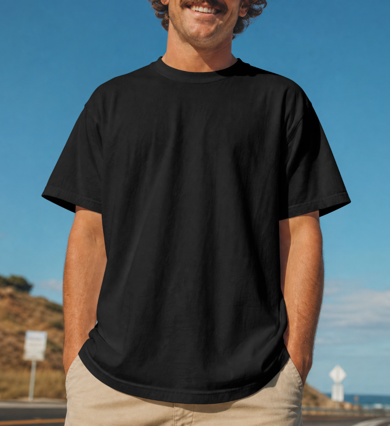 A young man wears a premium black tee with a 100% cotton, 8-ounce fabric weight that is heavy and super soft material 