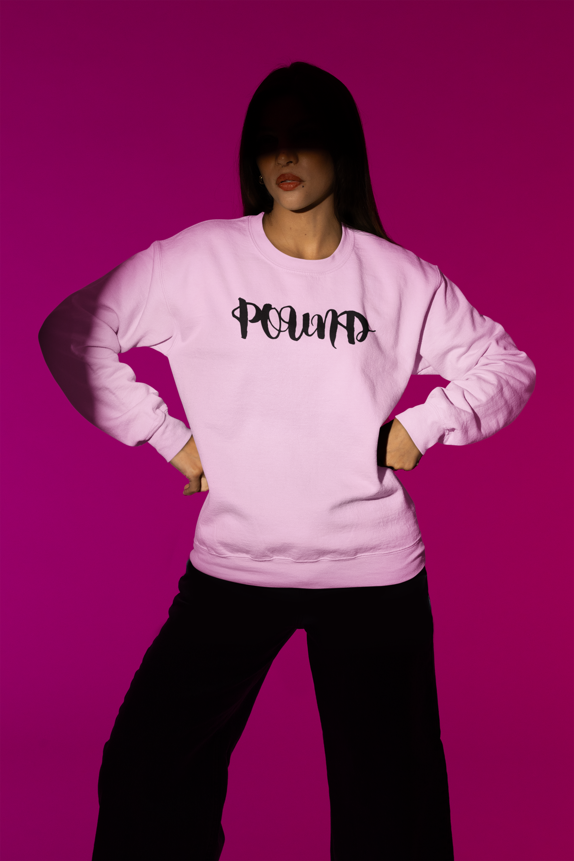gildan-sweatshirt-mockup-featuring-a-woman-posing-under-a-spotlight-in-a-studio-m50005.png