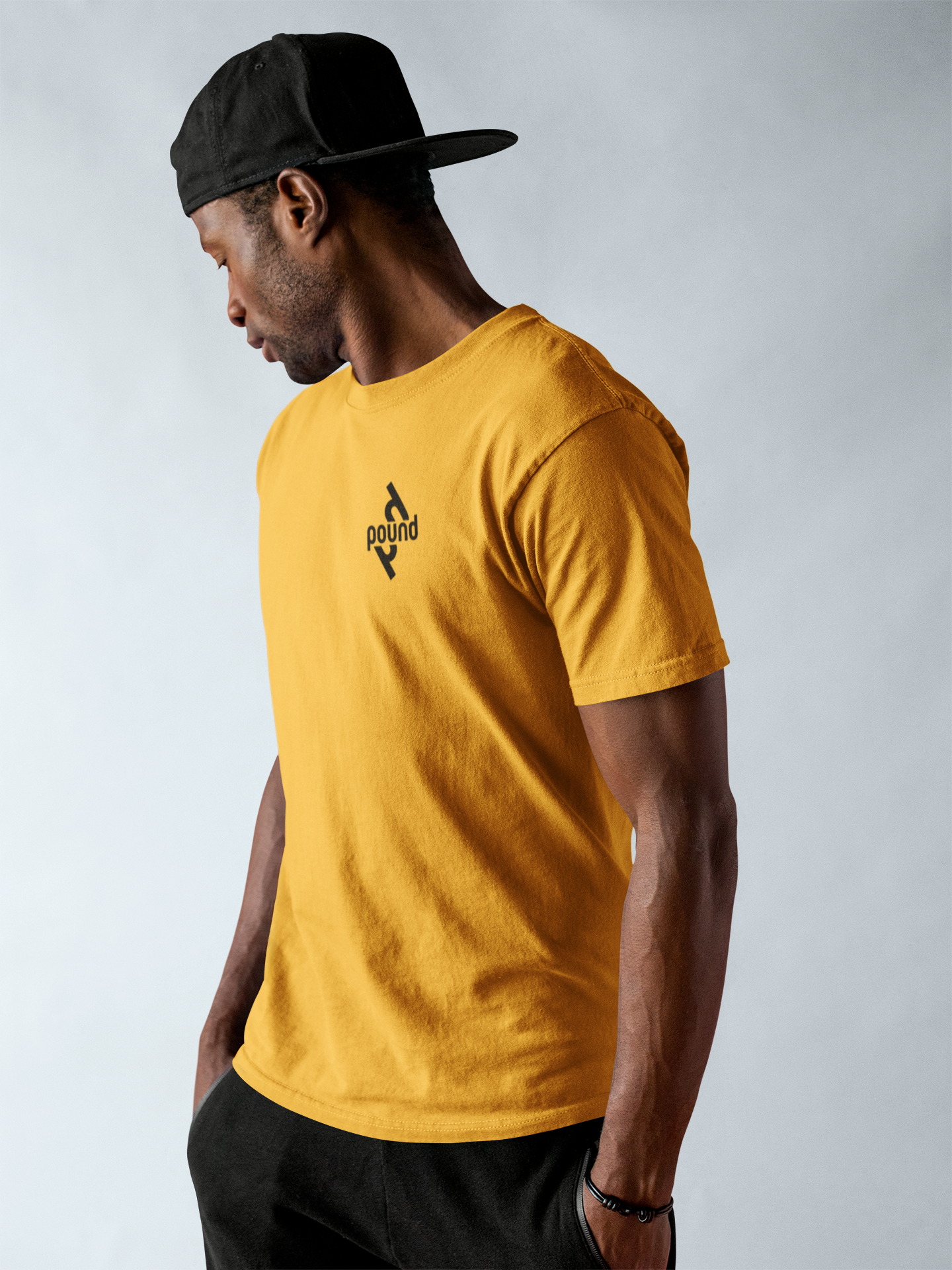 black-dude-wearing-a-round-neck-tee-mockup-while-against-a-solid-backdrop-a17154.png