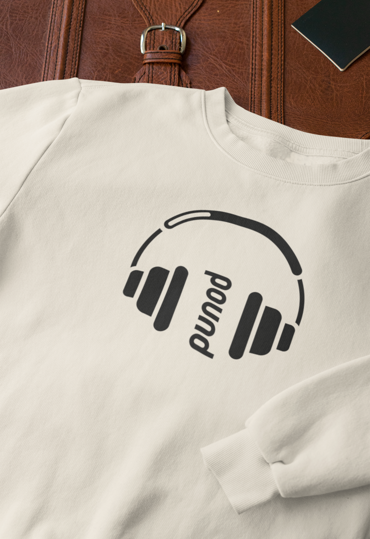 closeup-mockup-of-a-crewneck-sweatshirt-next-to-a-briefcase-33716 (1).png