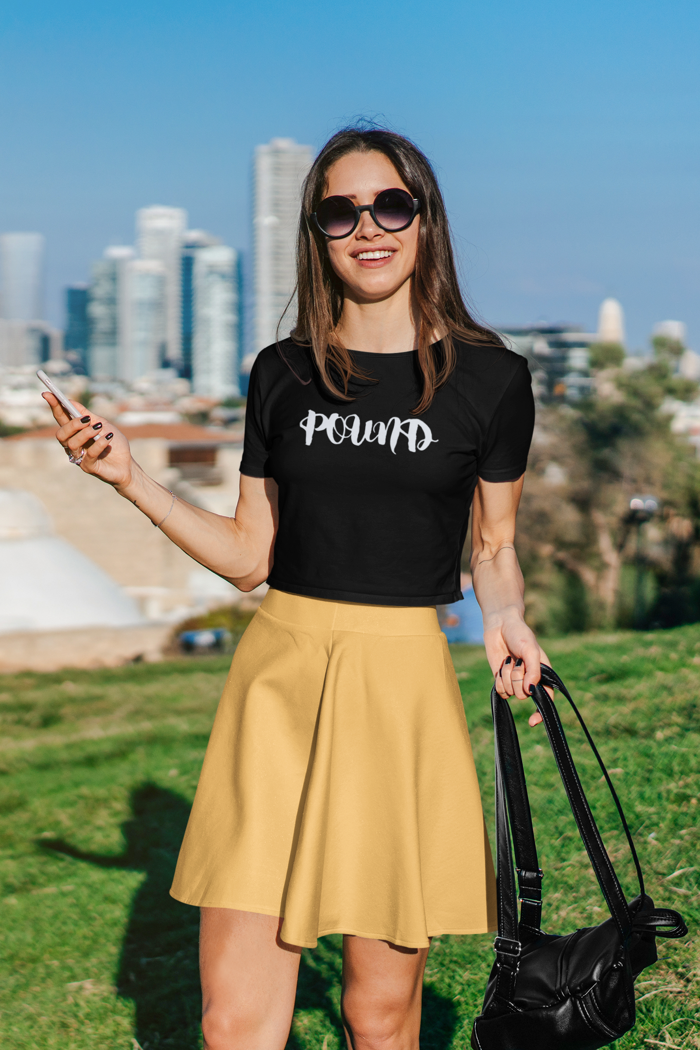 crop-top-mockup-featuring-a-woman-posing-against-a-big-city-setting-39763-r-el2 (1).png