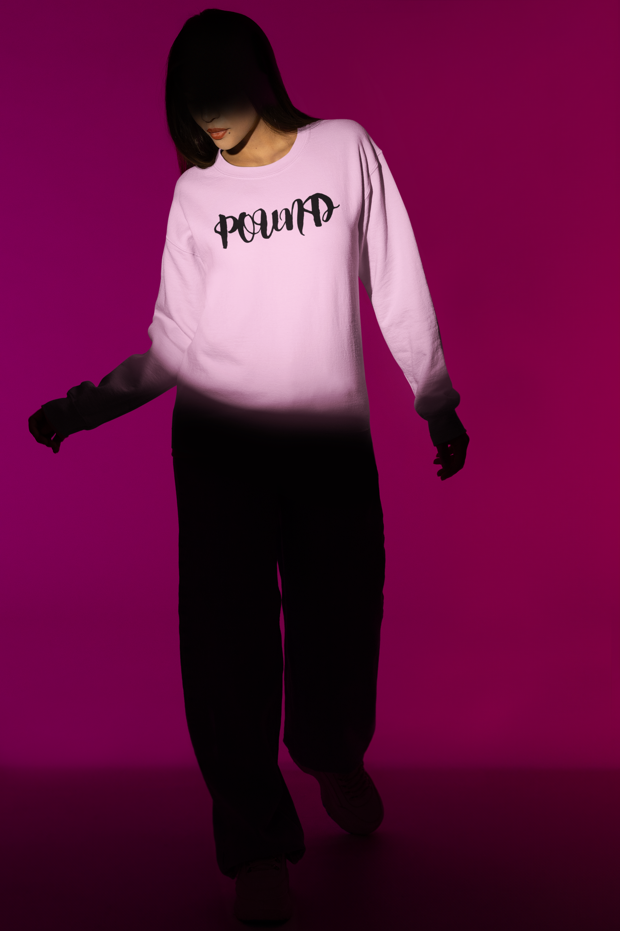 sweatshirt-mockup-featuring-a-woman-standing-on-the-spotlight-of-an-indoor-studio-m50009.png