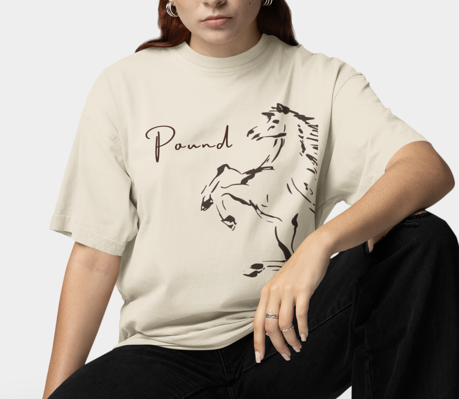 mockup-of-a-woman-wearing-an-oversized-t-shirt-with-a-crew-neck-in-a-studio-m38936 (1).png