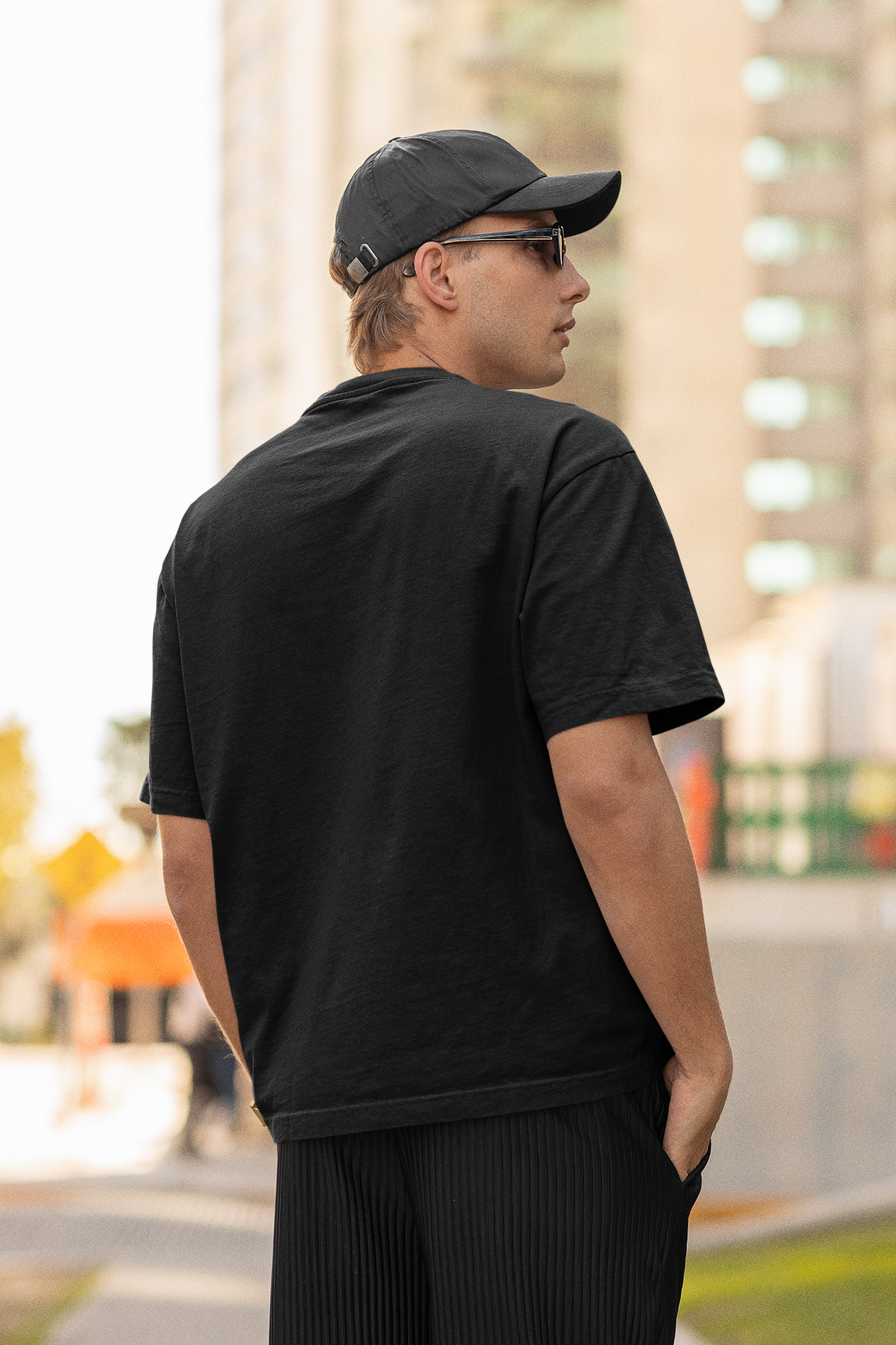 back-view-mockup-of-a-man-wearing-an-oversized-t-shirt-and-sunglasses-m25264.png