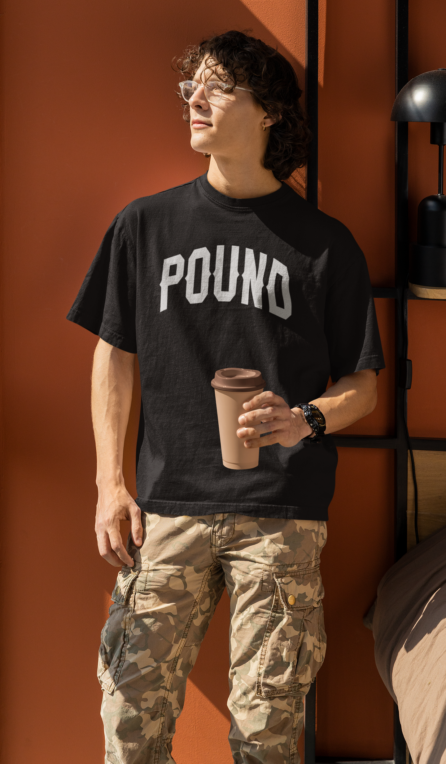 oversized-t-shirt-mockup-featuring-a-man-holding-a-coffee-m32075.png
