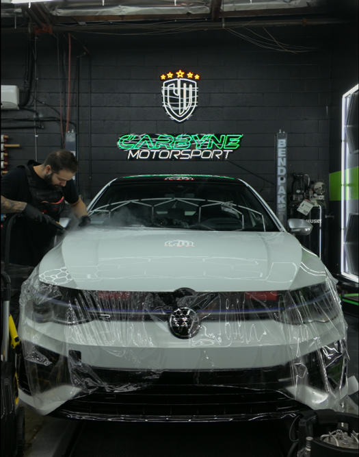 Applying paint protection film on a brand new Volkswagen Golf R at Carbyne Motorsport in Glendale / Los Angeles