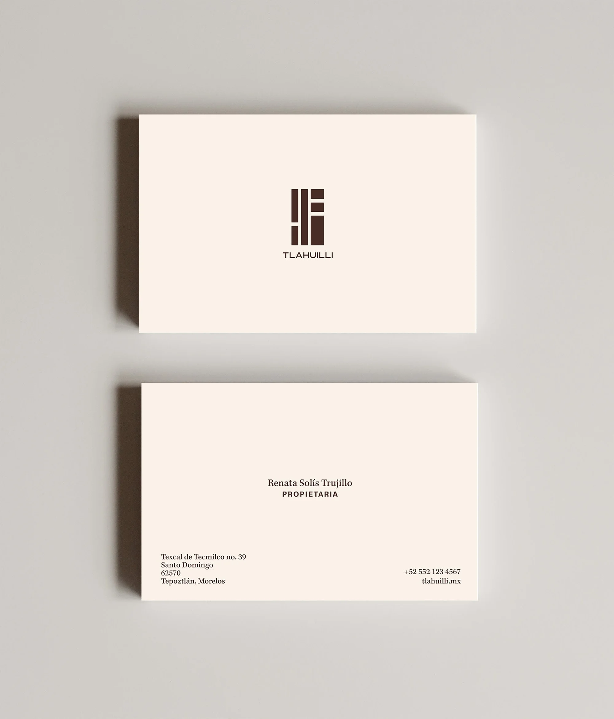 A white card with black text that displays the name, contact information, and address of a person or business. The card features a logo with stylized letters and the name TLAHUILLI.