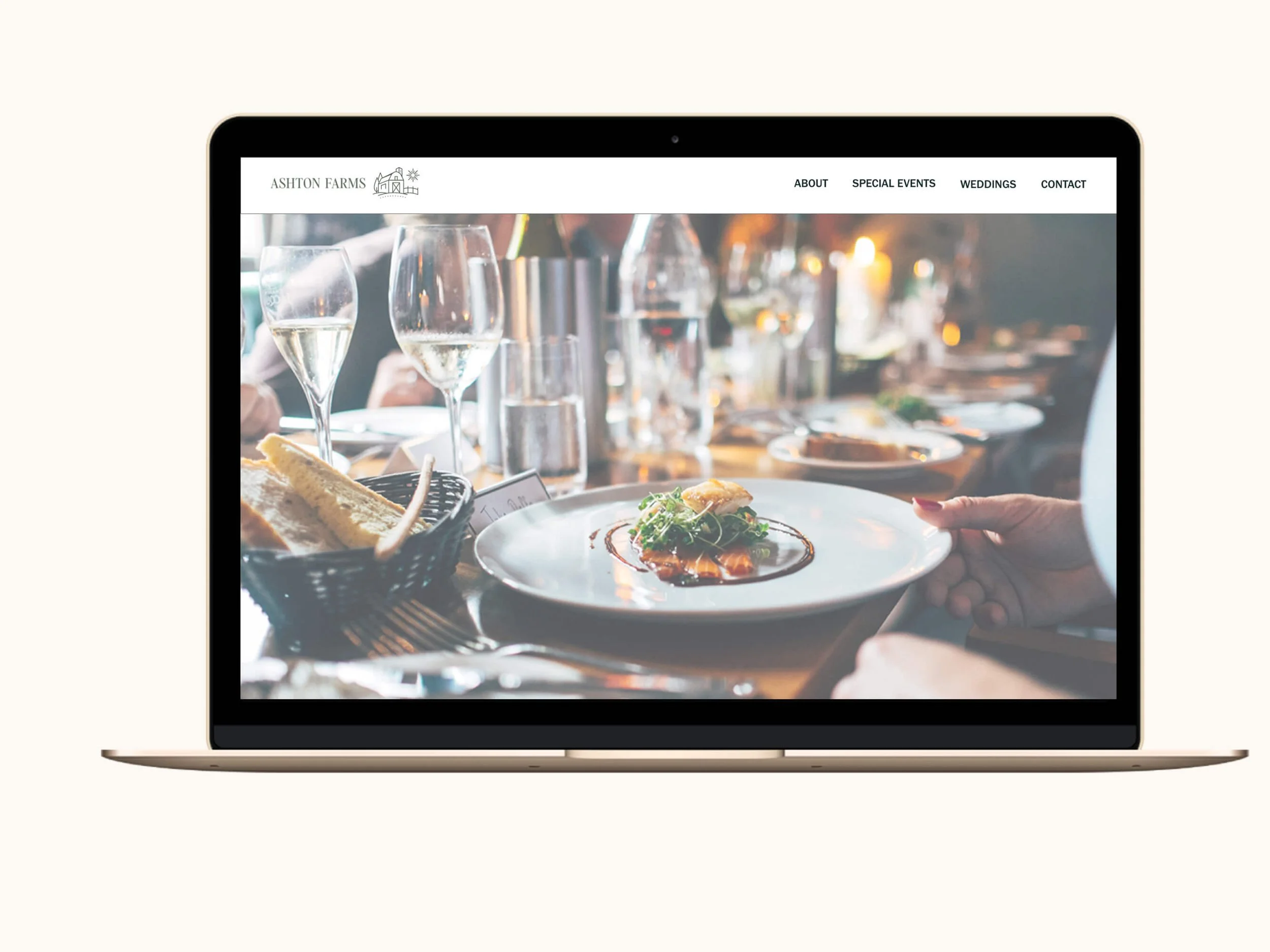 Screenshot of the Ashton Farms website displayed on a gold MacBook laptop, showing a full-width hero image of an elegant dinner party table setting.