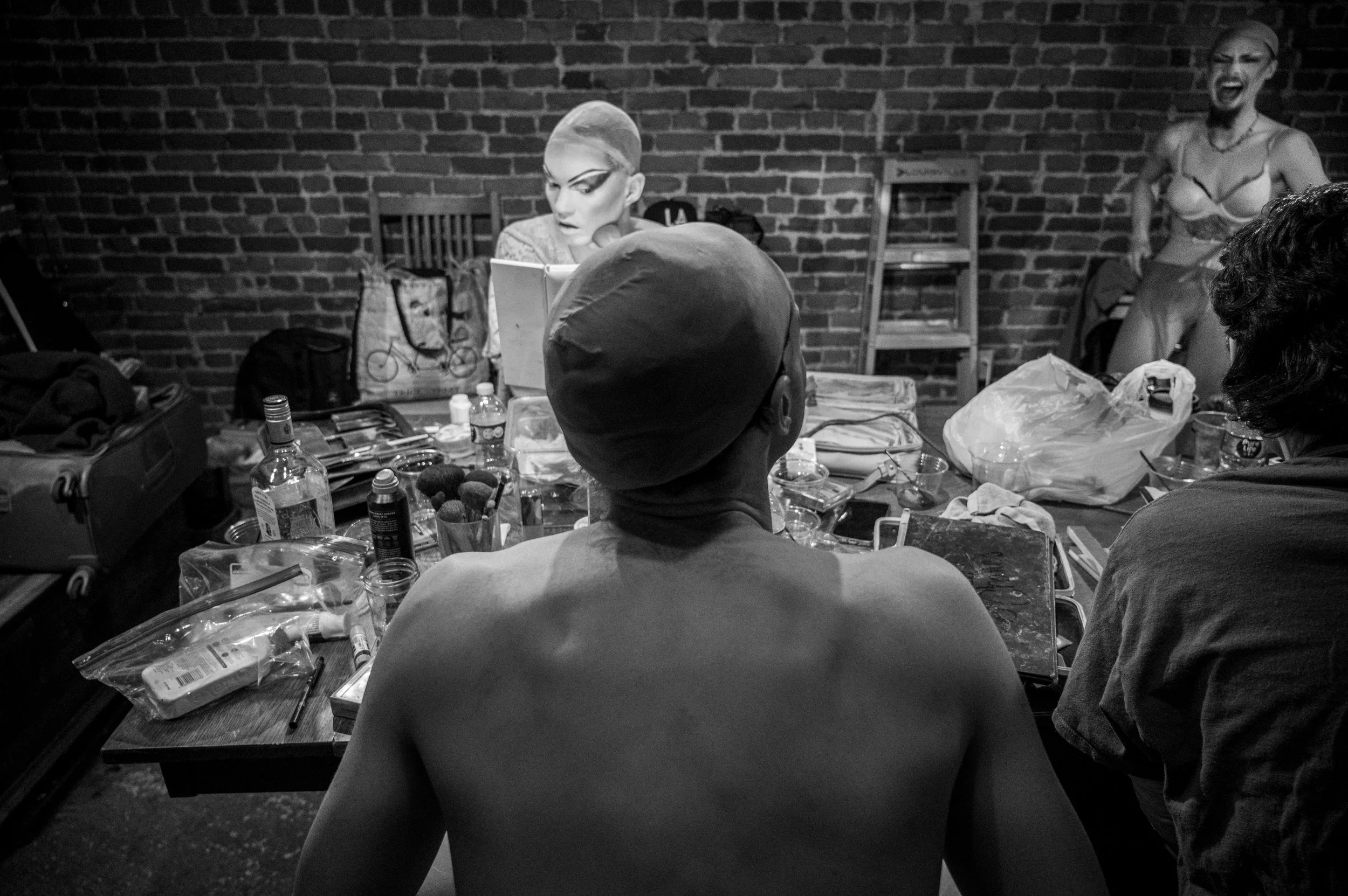 The Queens laugh and joke with one another while getting ready for the show. 