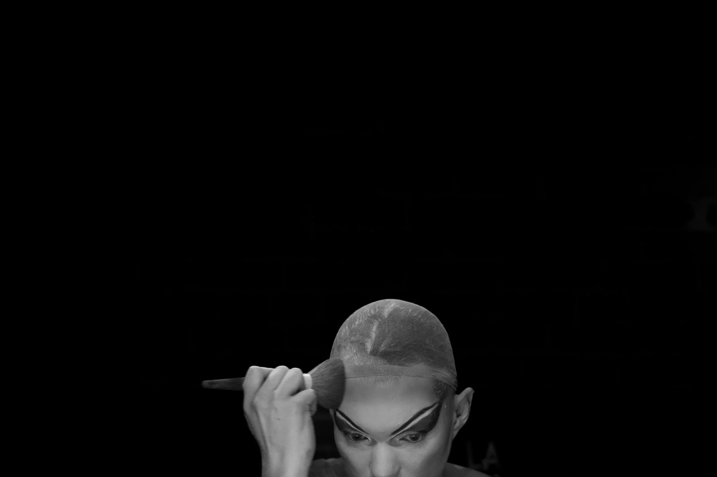 Nick smooths out his foundation before continuing with his makeup. 