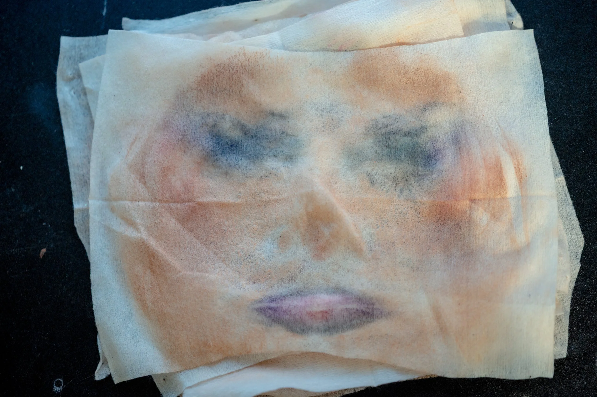Shenandoah wipes away her makeup after a performance, leaving traces of the look she wore earlier in the night. Remnants of foundation, eyeliner and lipstick stayed visible as she began removing the persona she had built for the stage.