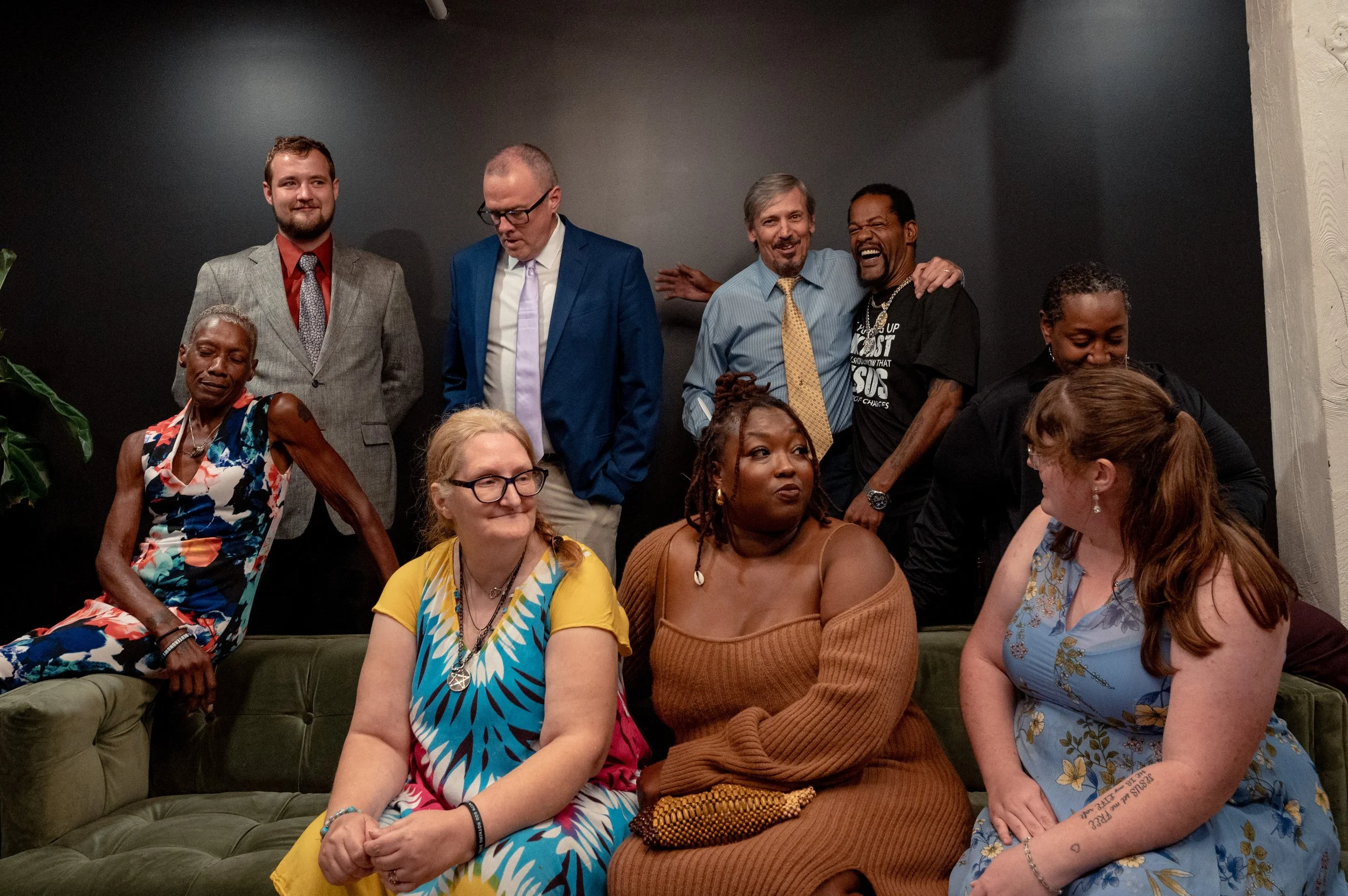 Staff members of Our Community Place pose for a group photograph in Harrisonburg, Va. Many members of the organization's staff have experienced homelessness themselves, bringing firsthand knowledge to their work serving unhoused residents in the Shen