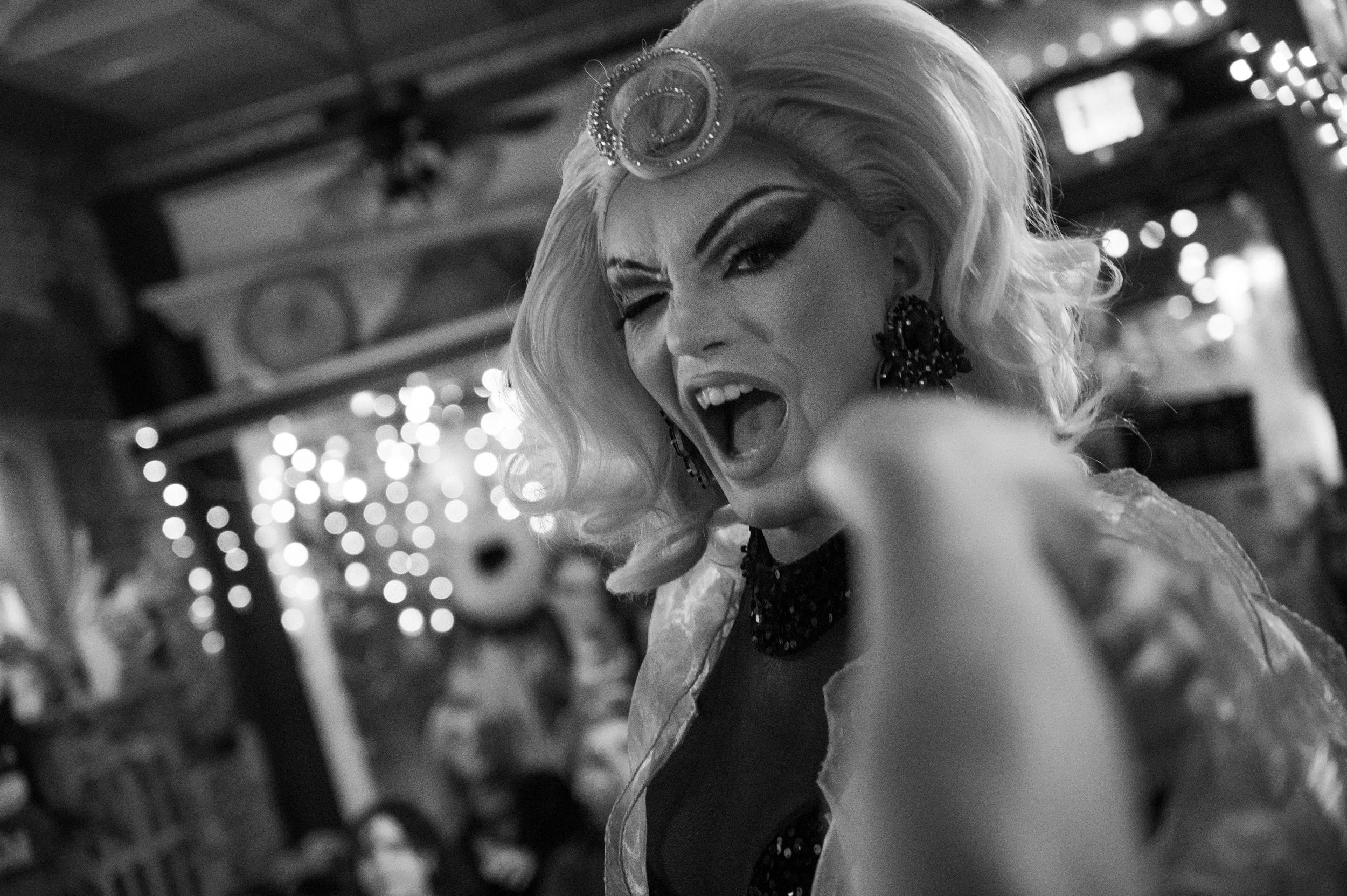 Nick winks and kisses an audience member after collecting her $1 tip.