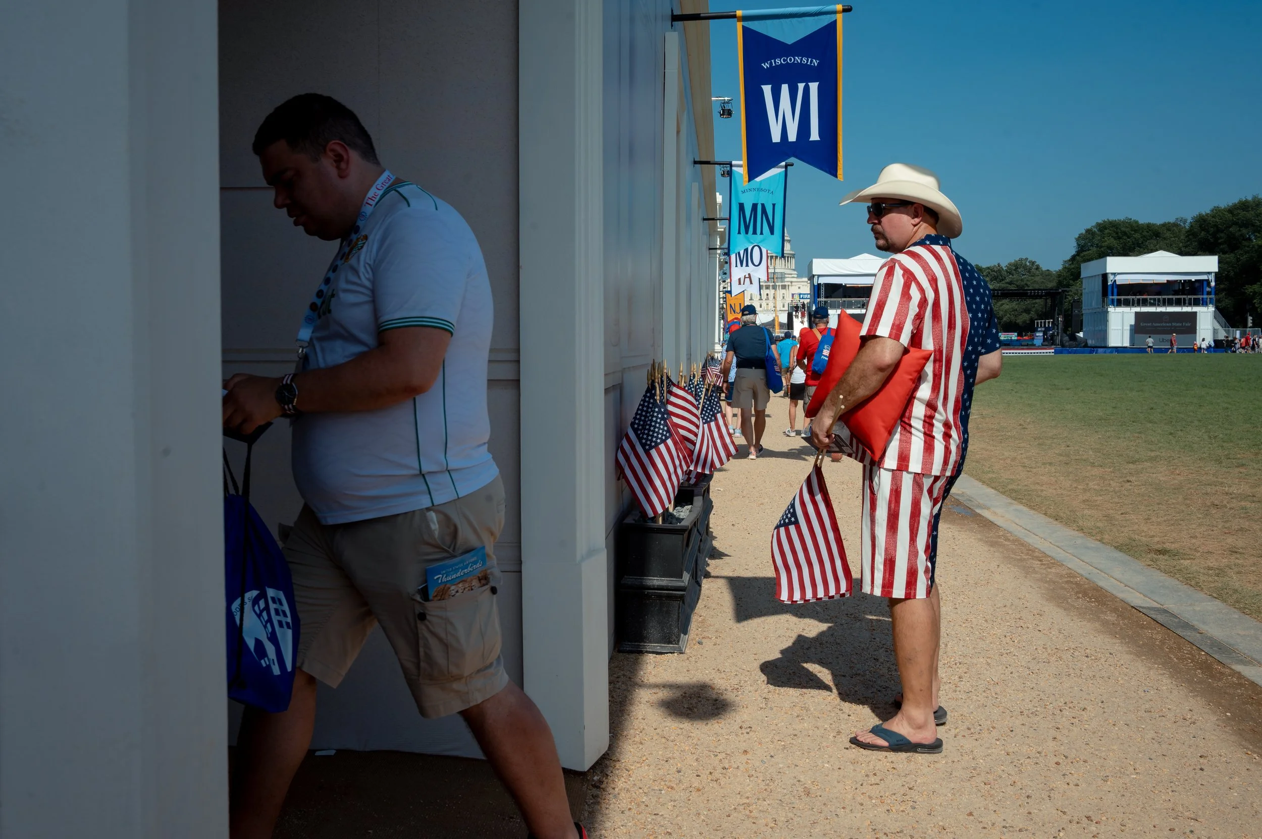 Doug Bartrem (right), of Wisconsin, visits his state's booth on the National Mall during the Great American State Fair in Washington, D.C., on July 2, 2026. The fair, part of the America 250 celebrations, featured exhibits representing all 50 states.