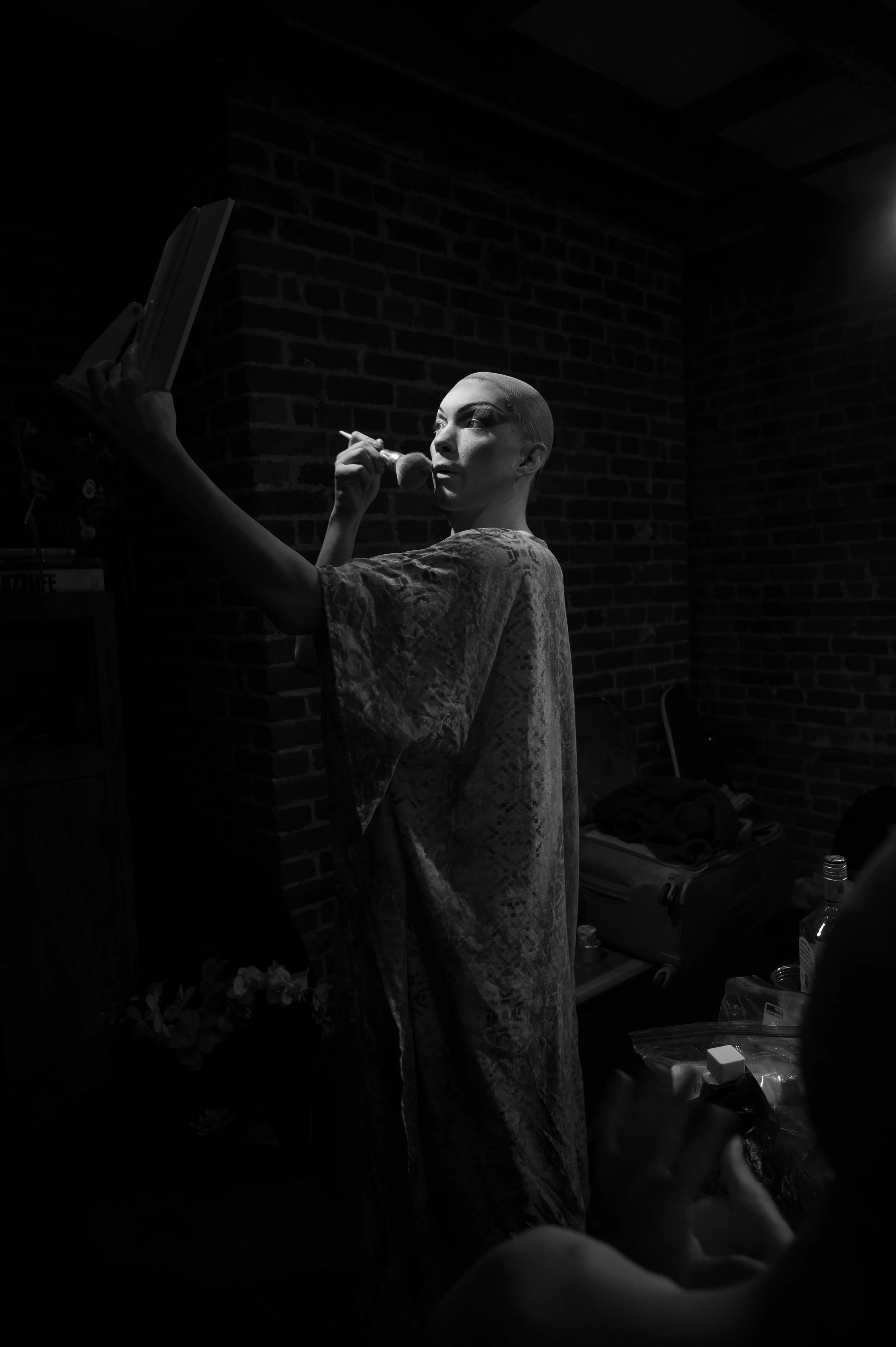 Nick moves closer to the light to make sure her makeup is looking good. 