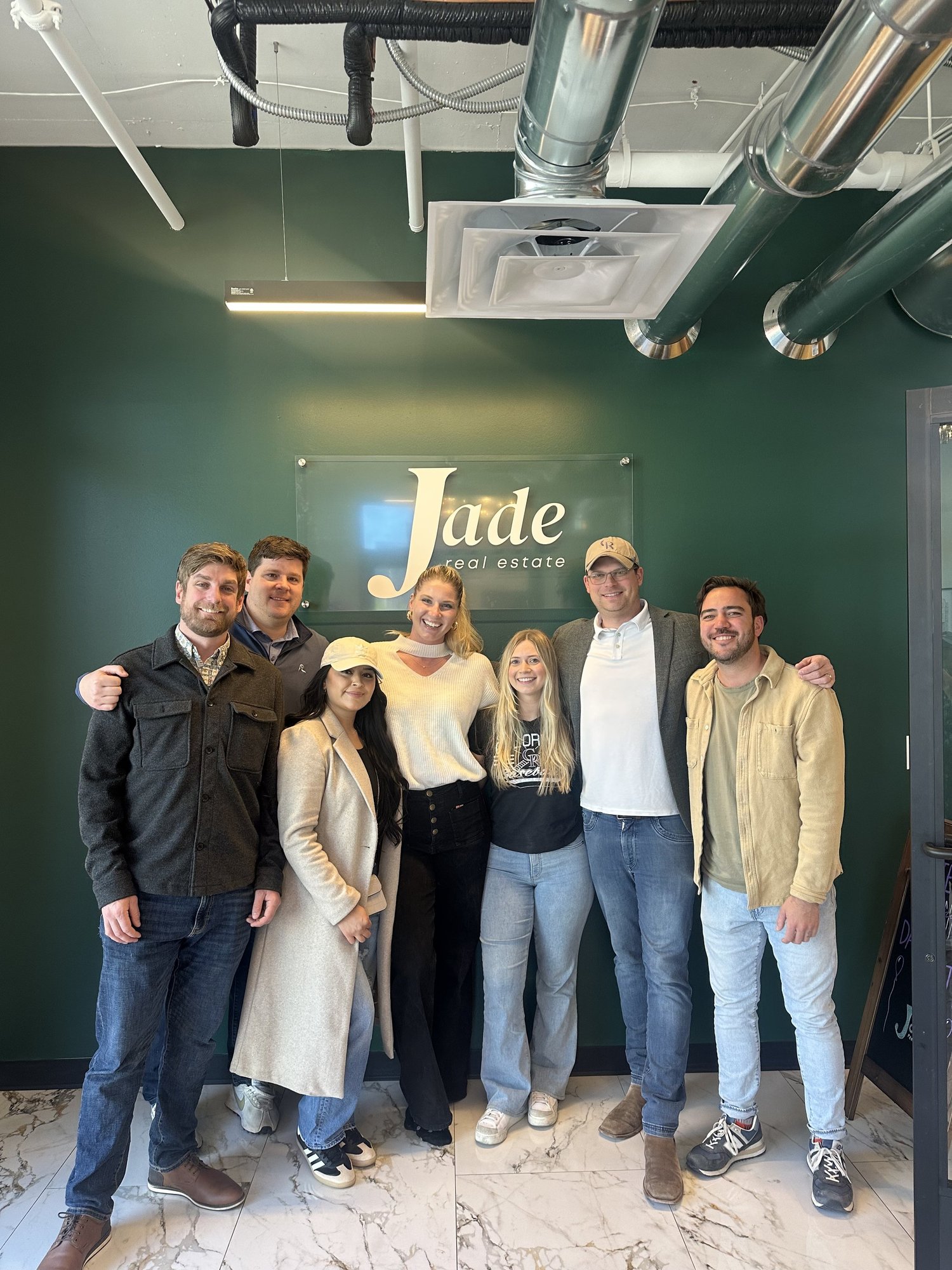 A group of Jade Real Estate agents at the office
