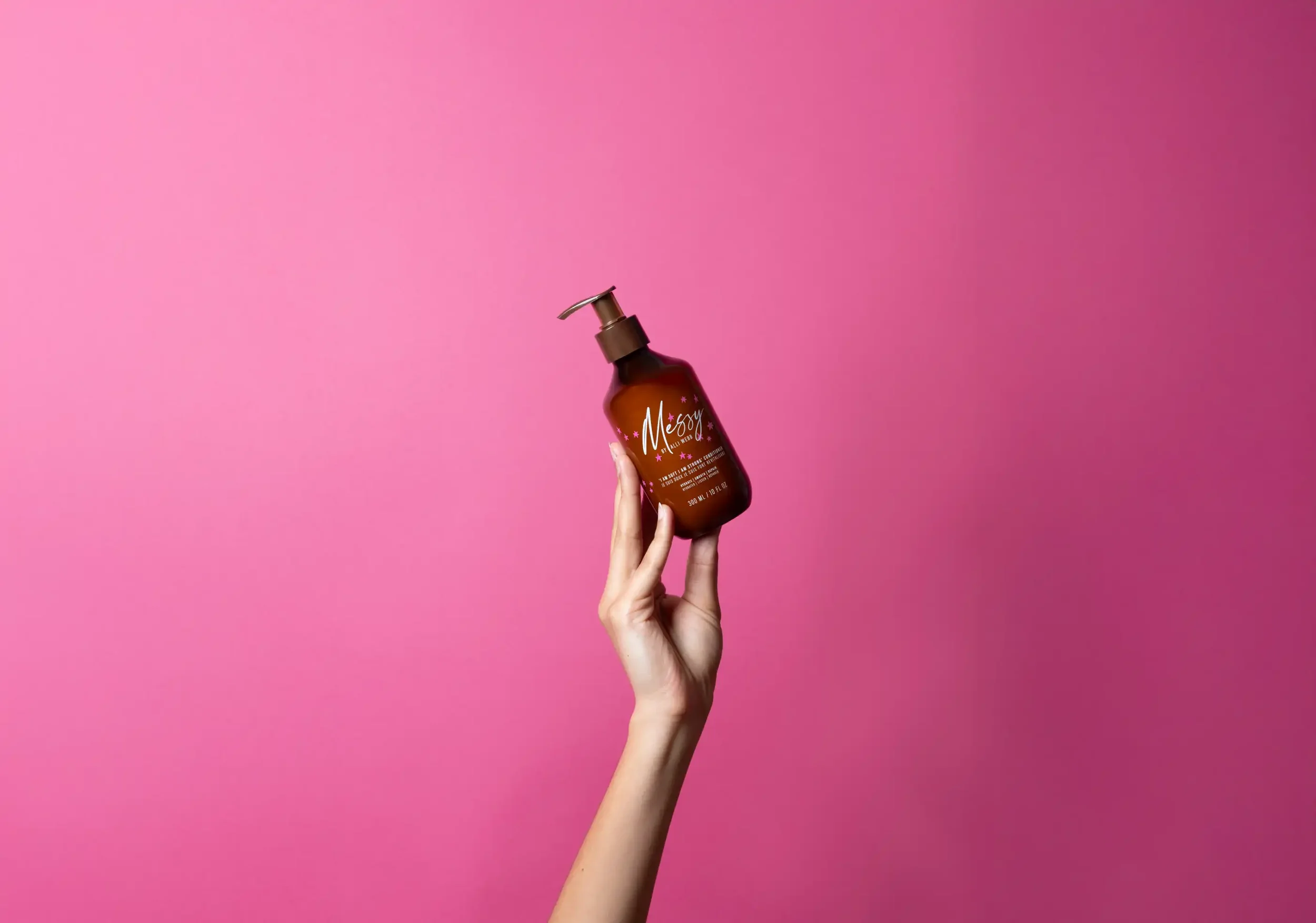 messy2_7_25_341_conditioner_hand_pink_1_1x.webp