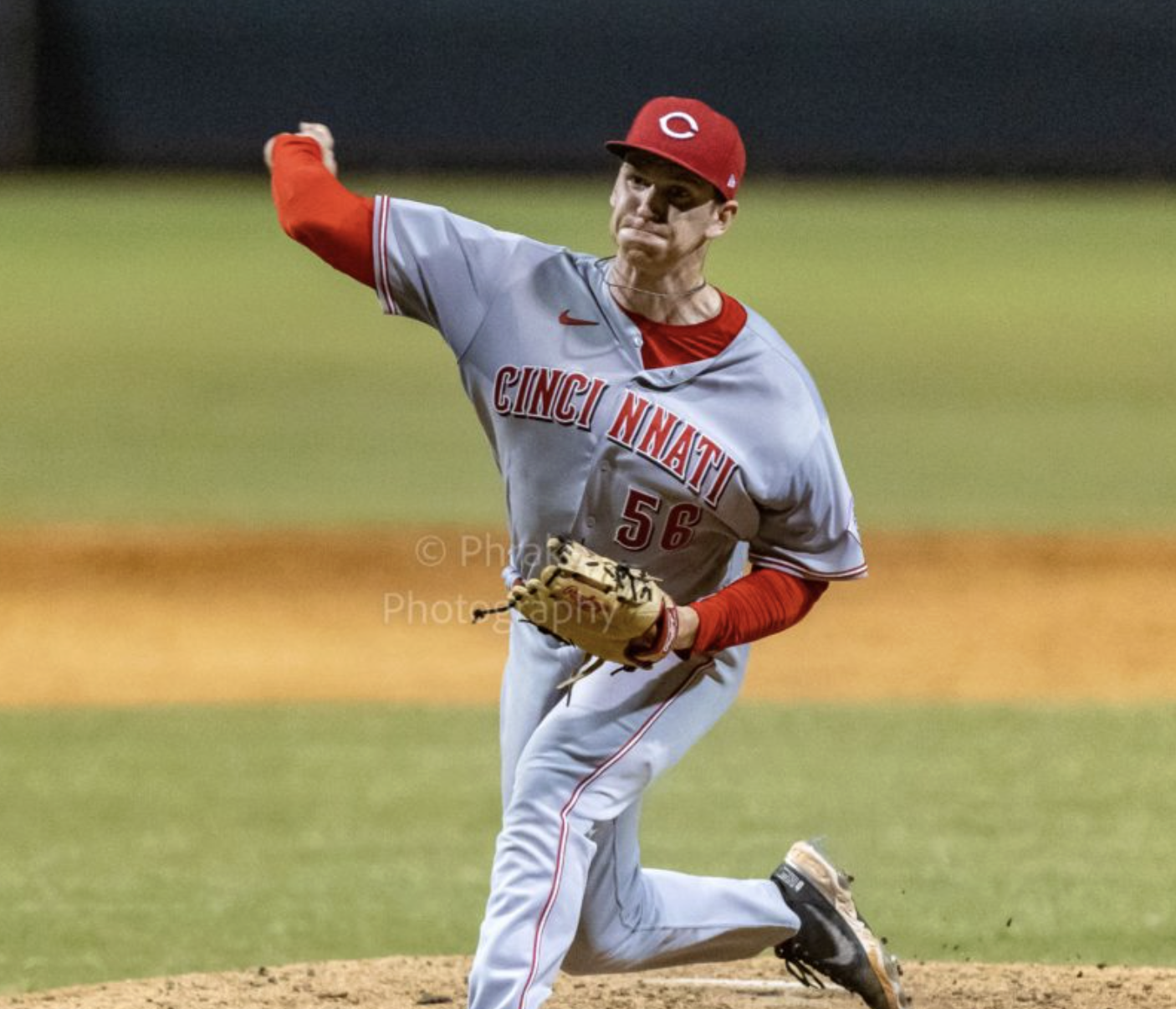 Brody Jessee pitching in a Reds uniform