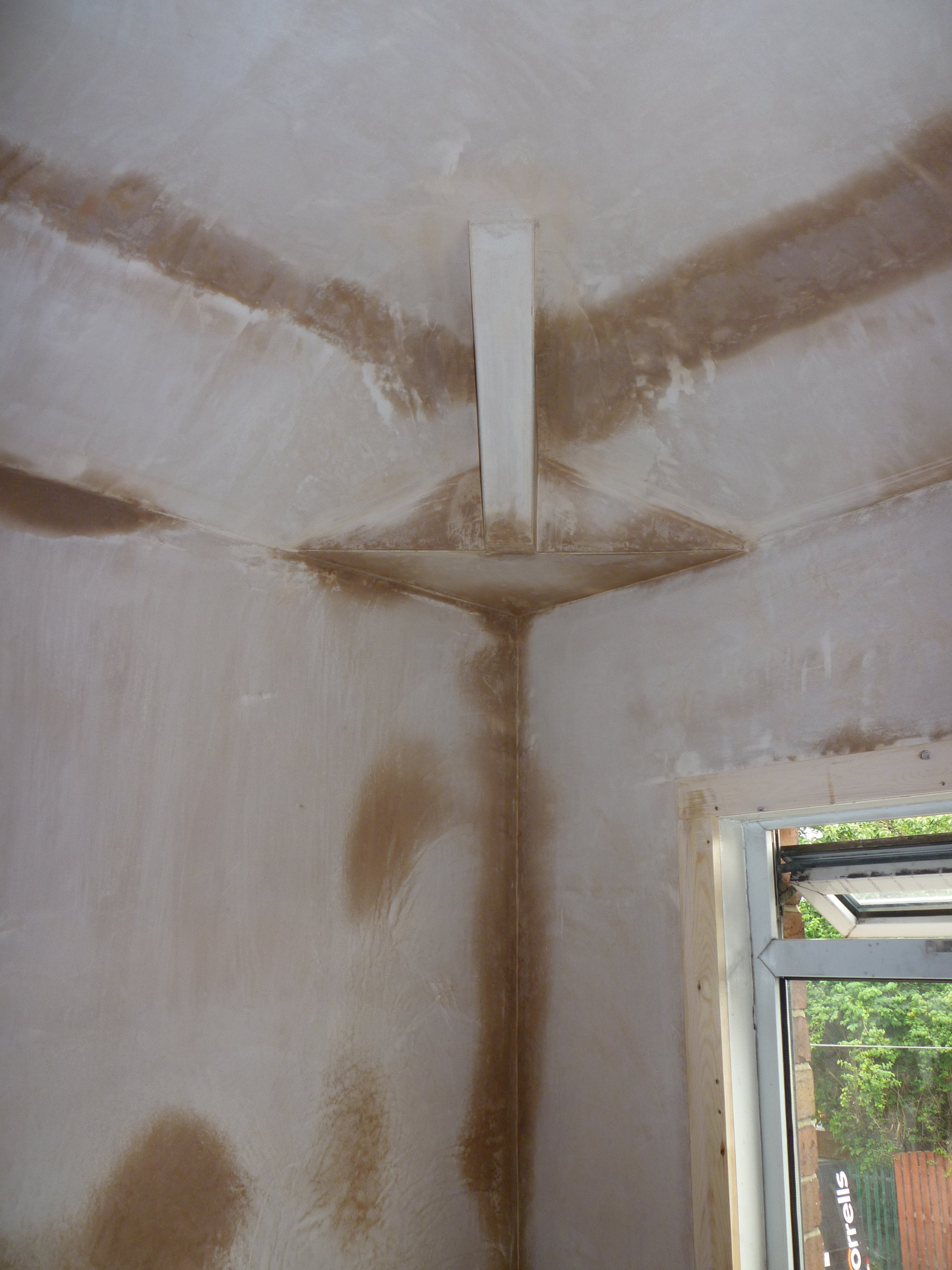 Corner of bedroom ceiling plastered
