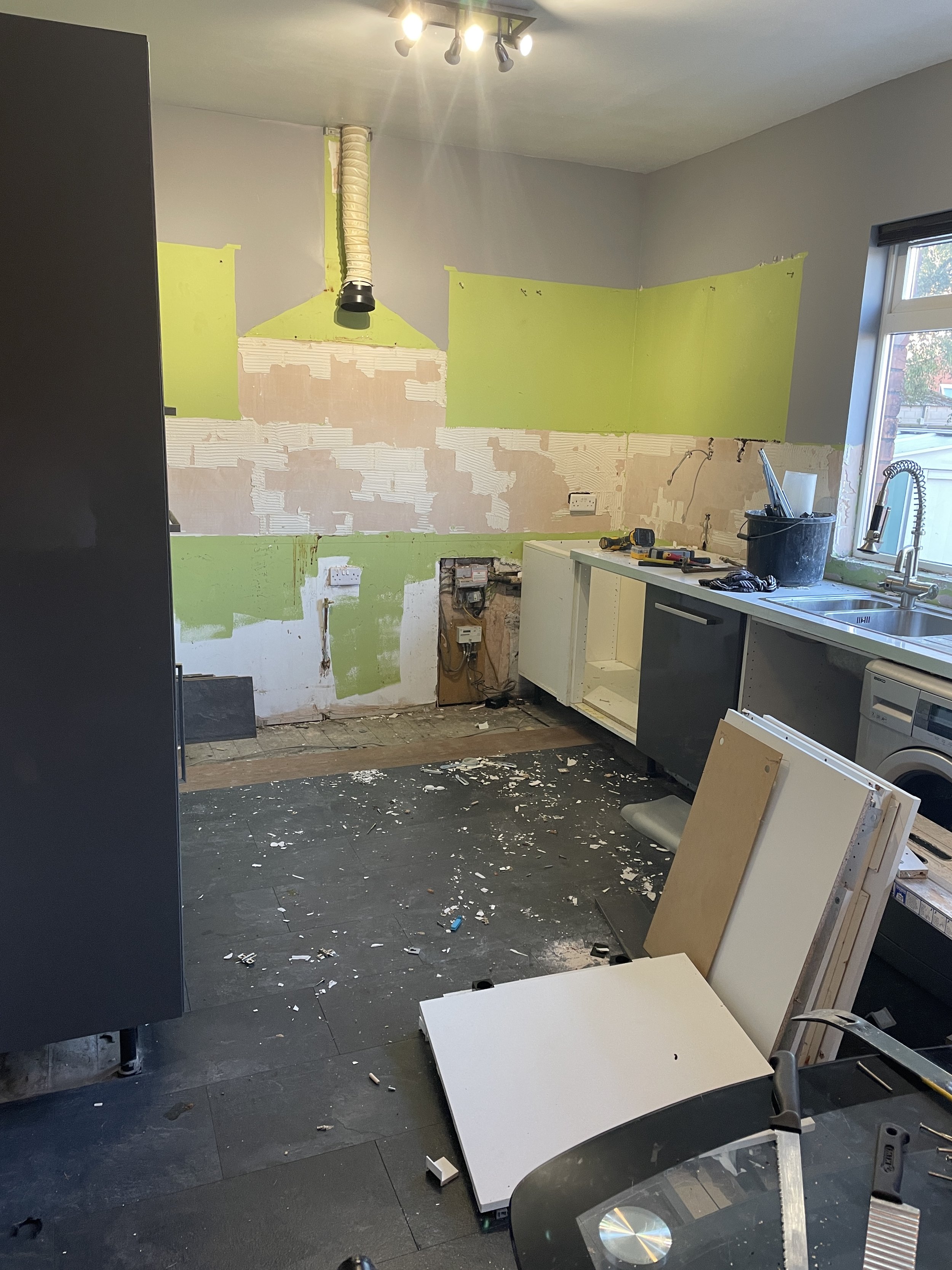 Mid-kitchen renovation with removal of wall and floor units