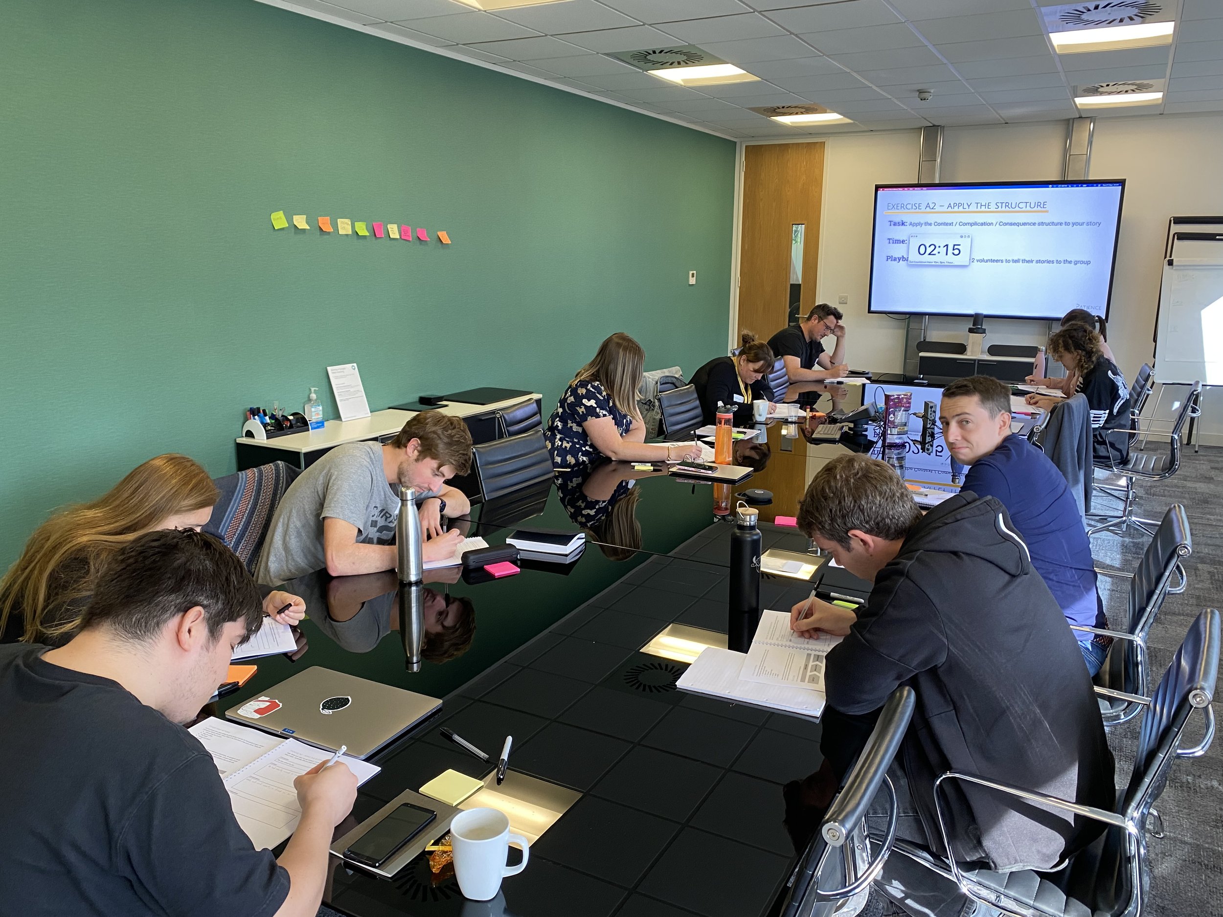 Course attendees work on their stories