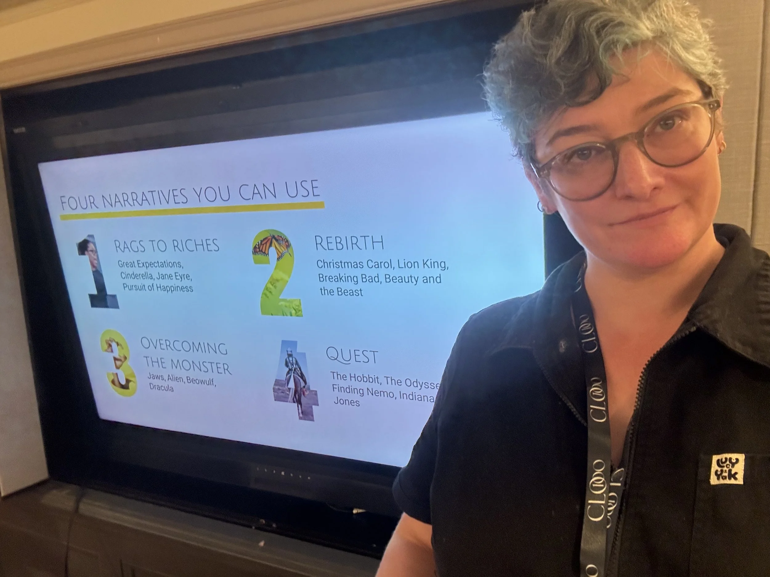 Hari stands in front of a PPT slide showing the 4 most effective story plots for business