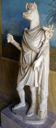 The Kynomorphism of Anubis in Iconography and Cult: Between Animal and Human, Between Egypt and Greece