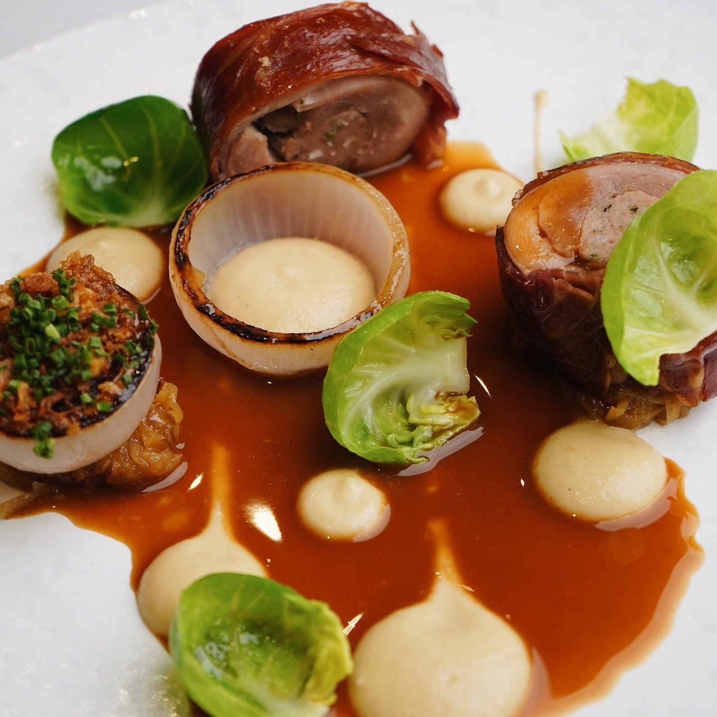 Confit Turkey Leg Wrapped in Crispy Parma Ham / Pork &amp; Thyme Farce / Onion Textures / Brussel Sprouts / Turkey Jus

Available as part of our festive menu 💜

#bohemiajersey #theclubjersey #jerseyci #visitjersey #visitjerseyci #michelinguide