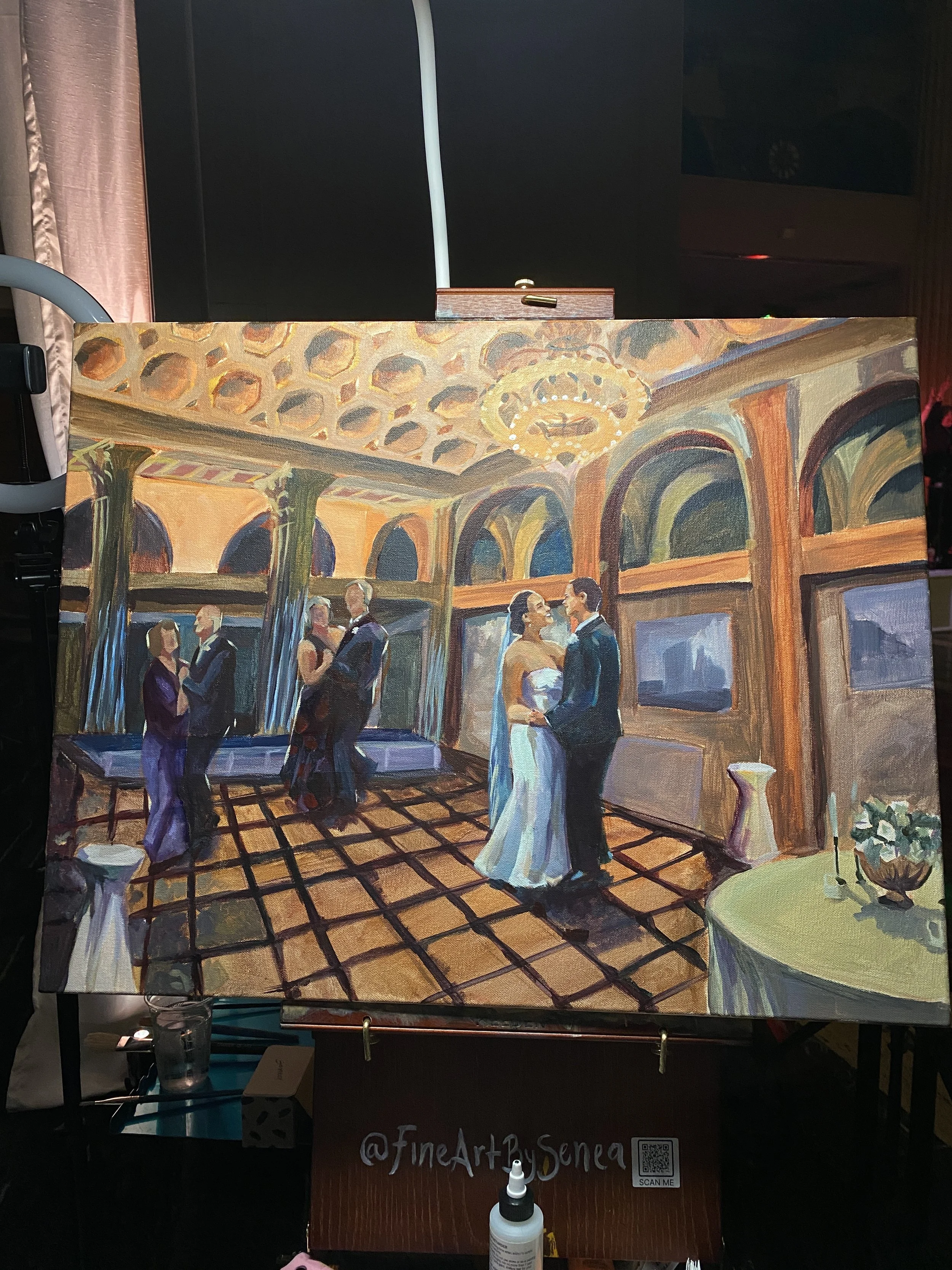 Senea painting at a wedding and receiving thanks