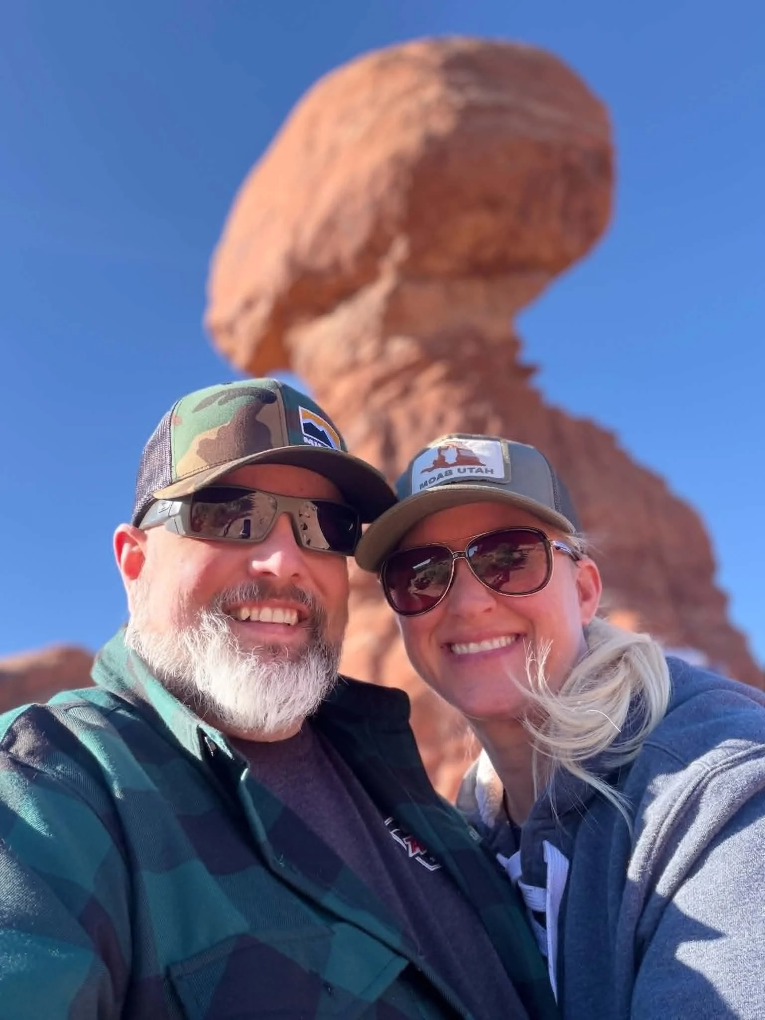 Josh and Becky Friesen, owners of Mill City Synthetics AMSOIL dealership, at Balanced Rock in Moab Utah