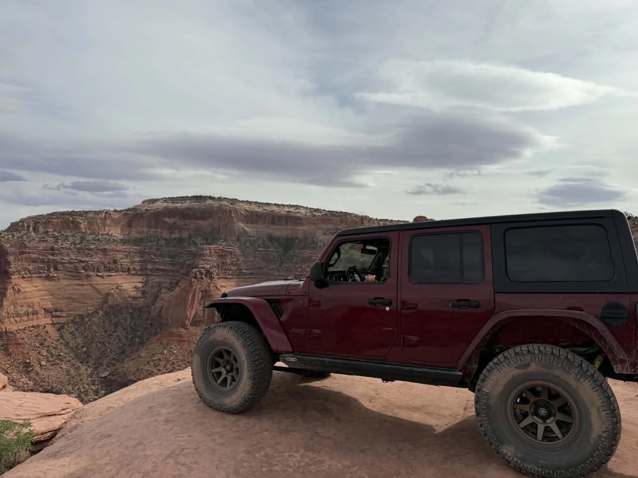 Jeep Wrangler on red rock terrain in Moab Utah — Mill City Synthetics authorized AMSOIL dealer