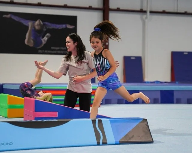 girl having fun tumbling gymnastics