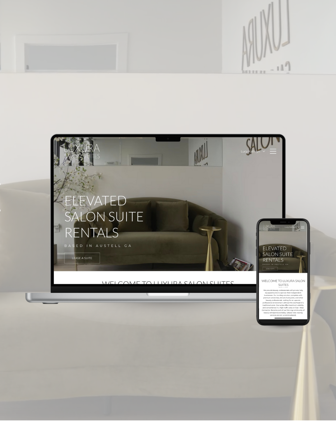 Website mock up infront of Olive sofa
