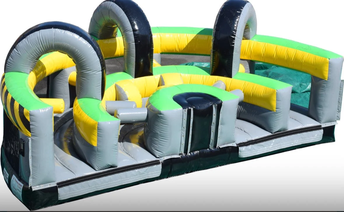 Colorful inflatable obstacle course with arches, slides, and barriers, designed for outdoor play or events.